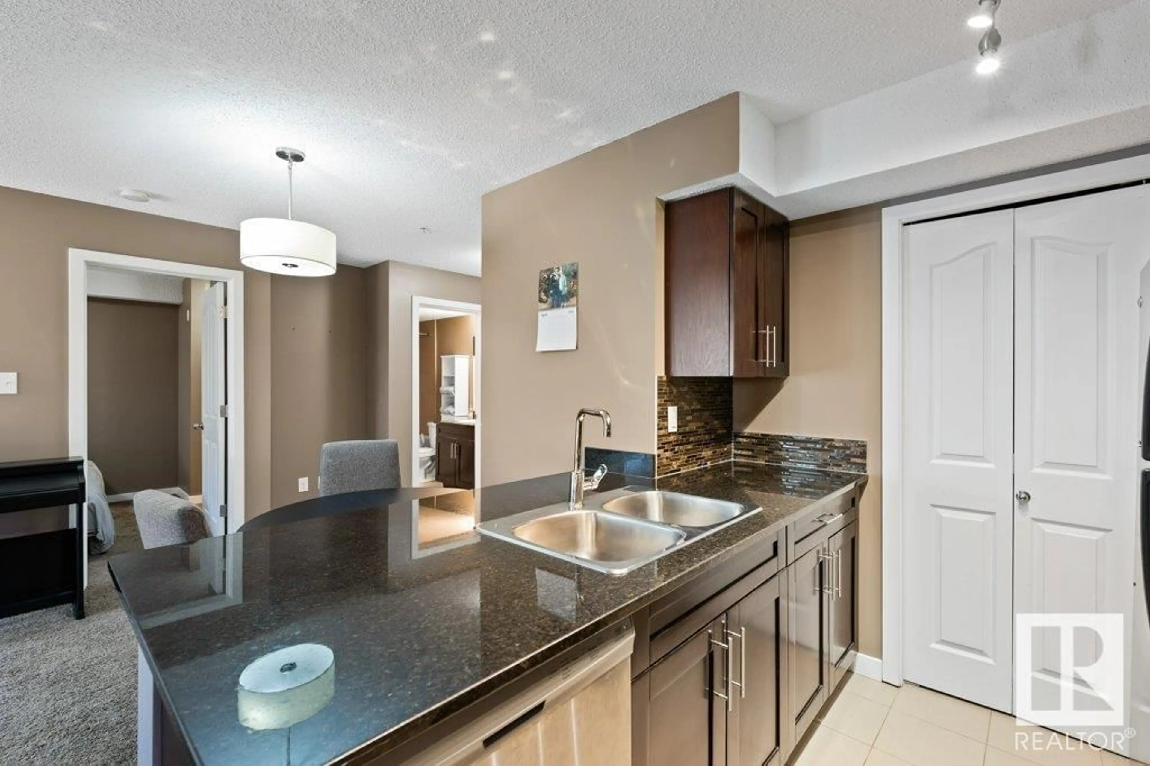 Open concept kitchen, ceramic/tile floor for #110 1060 MCCONACHIE BV NW, Edmonton Alberta T5Y0W9