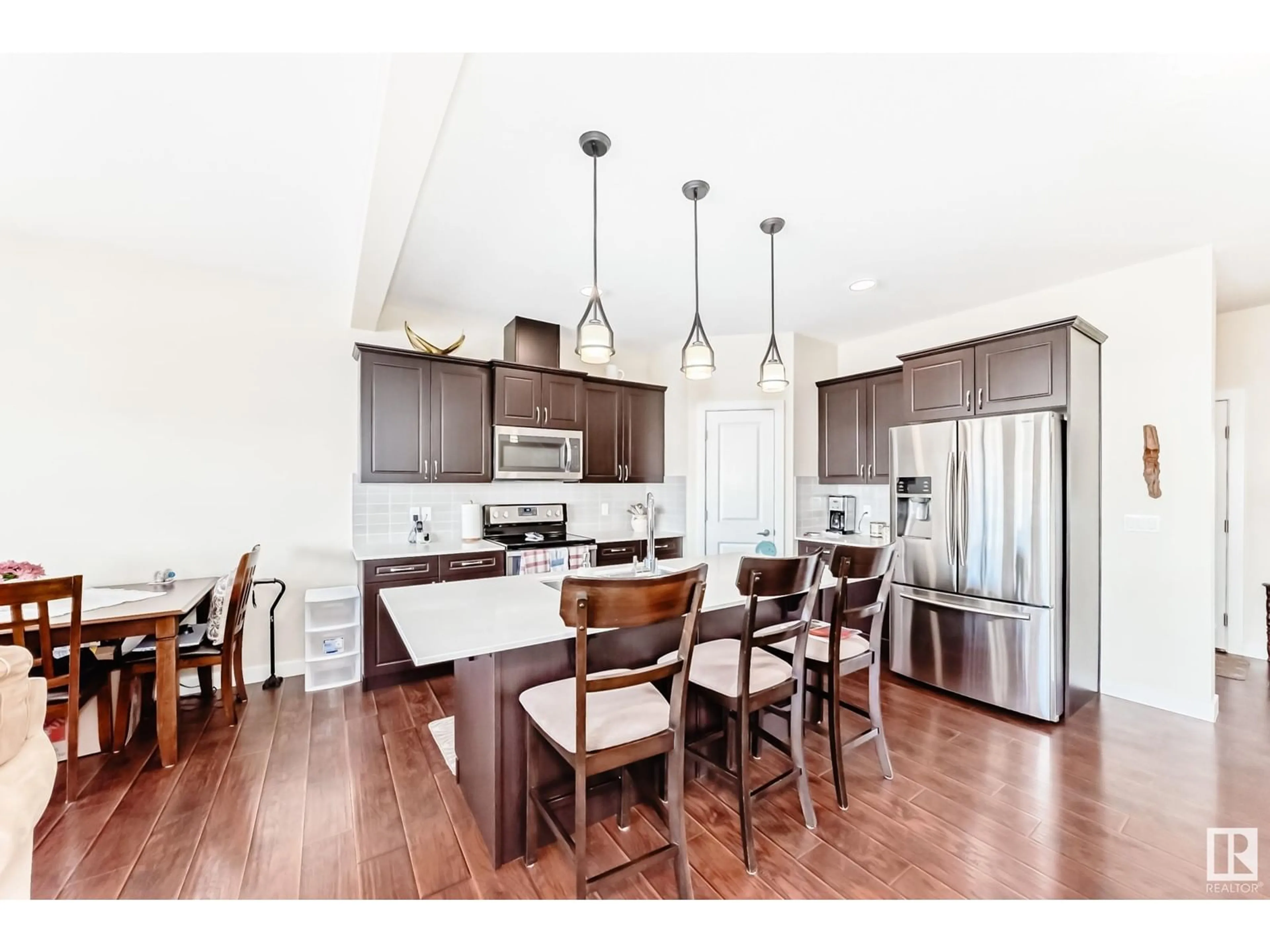 Open concept kitchen, wood/laminate floor for 8589 CUSHING PL SW, Edmonton Alberta T6W3R4