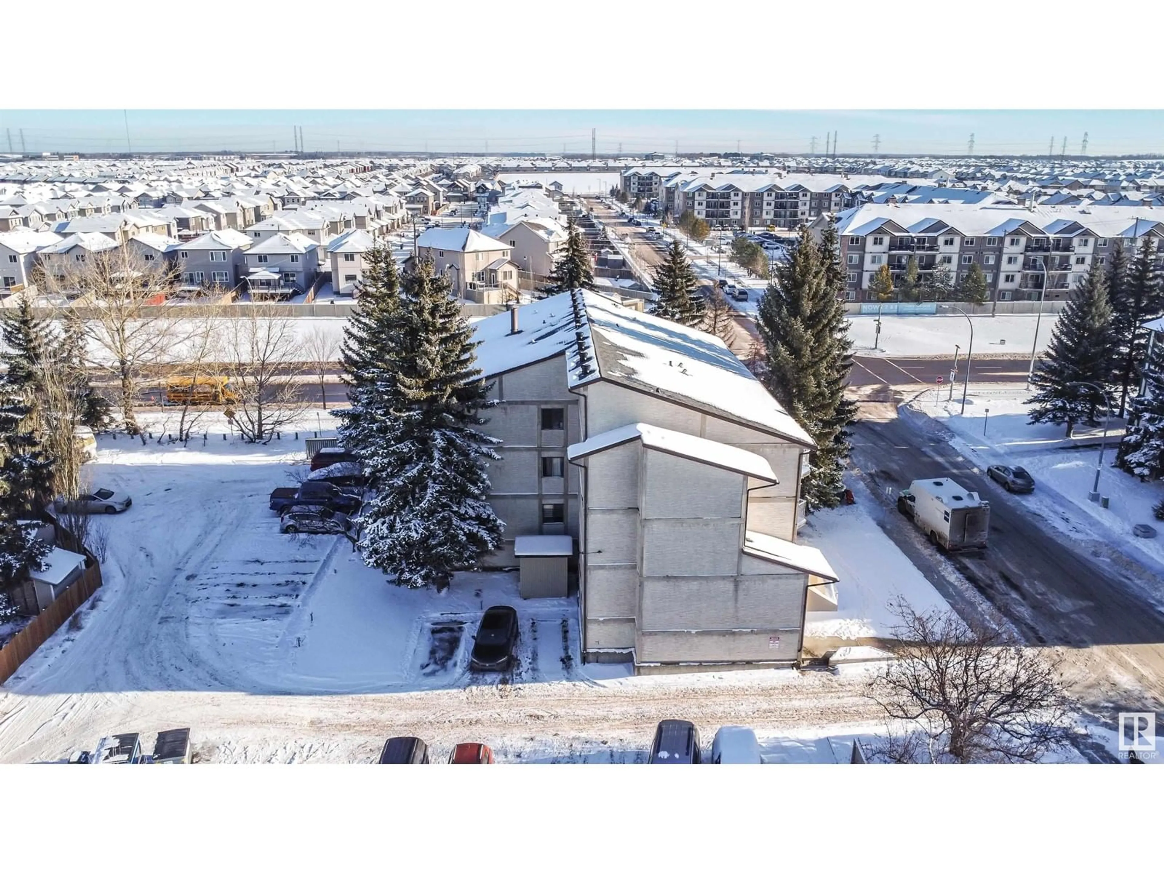 A pic from outside/outdoor area/front of a property/back of a property/a pic from drone, building for #103 - 3404 18 AV, Edmonton Alberta T6L3C2