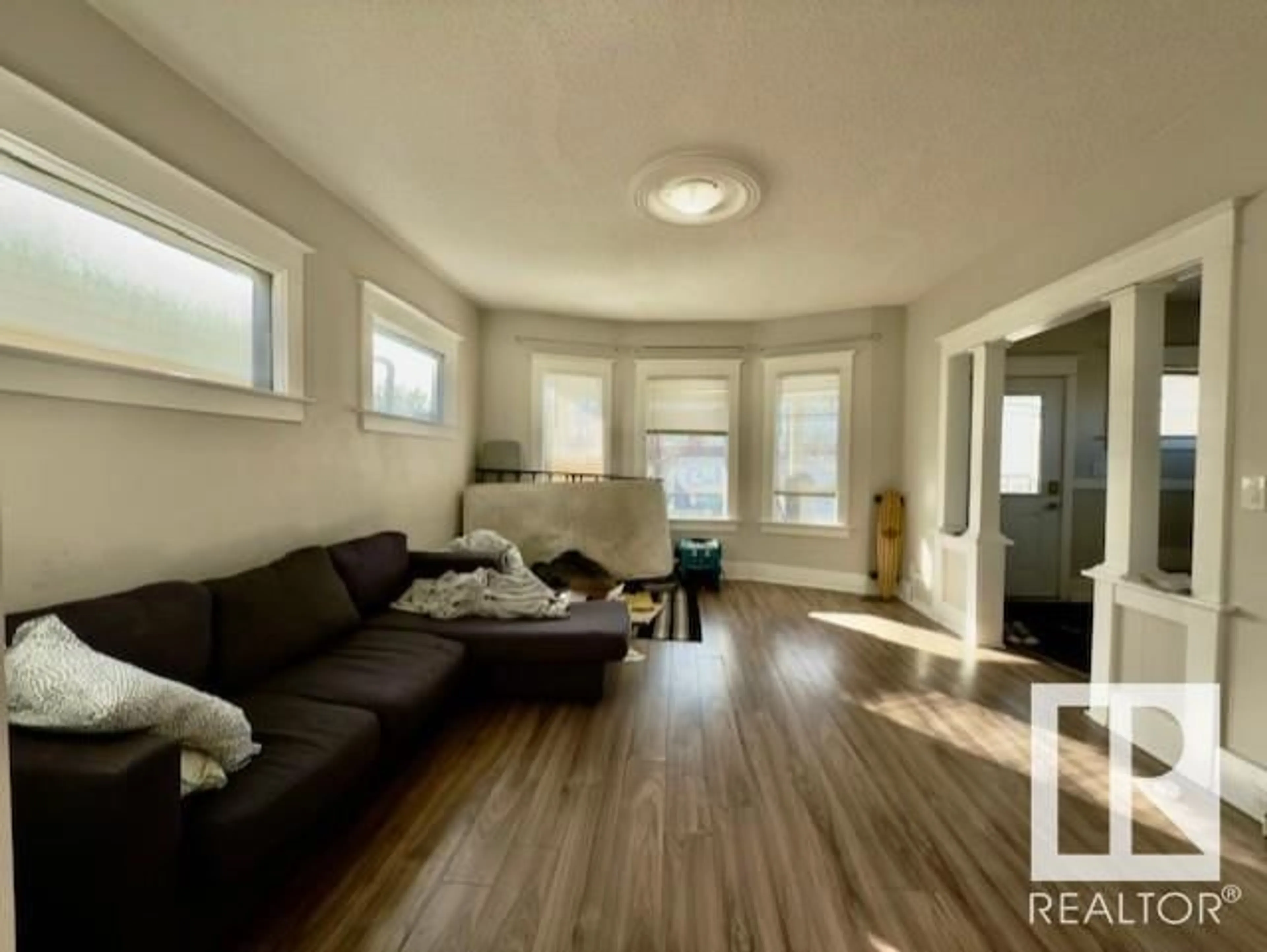 Living room with furniture, unknown for 9862 76 AV, Edmonton Alberta T6E1K5