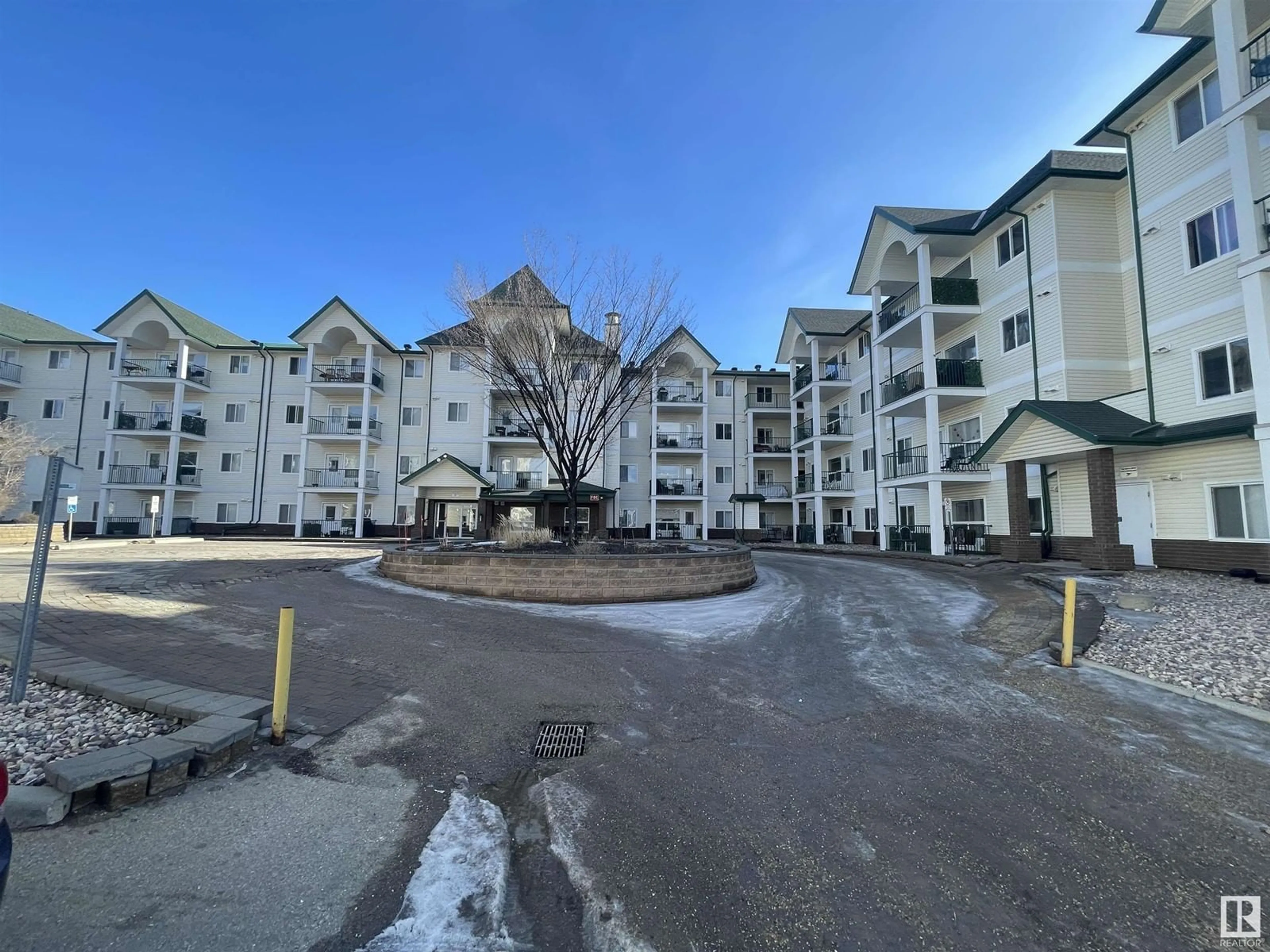 A pic from outside/outdoor area/front of a property/back of a property/a pic from drone, mountain view for #210 13625 34 ST NW, Edmonton Alberta T5A0E3