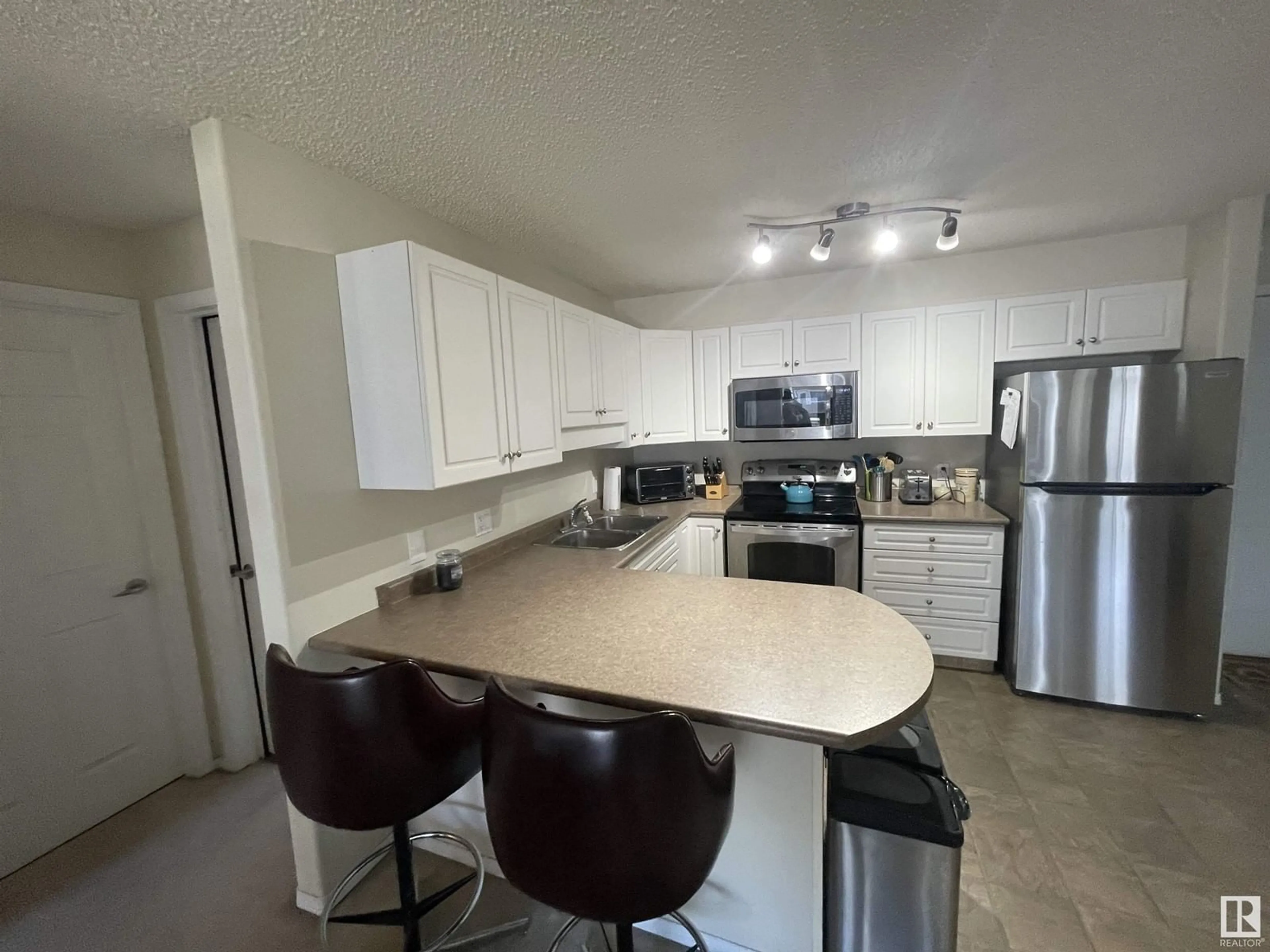 Open concept kitchen, unknown for #210 13625 34 ST NW, Edmonton Alberta T5A0E3