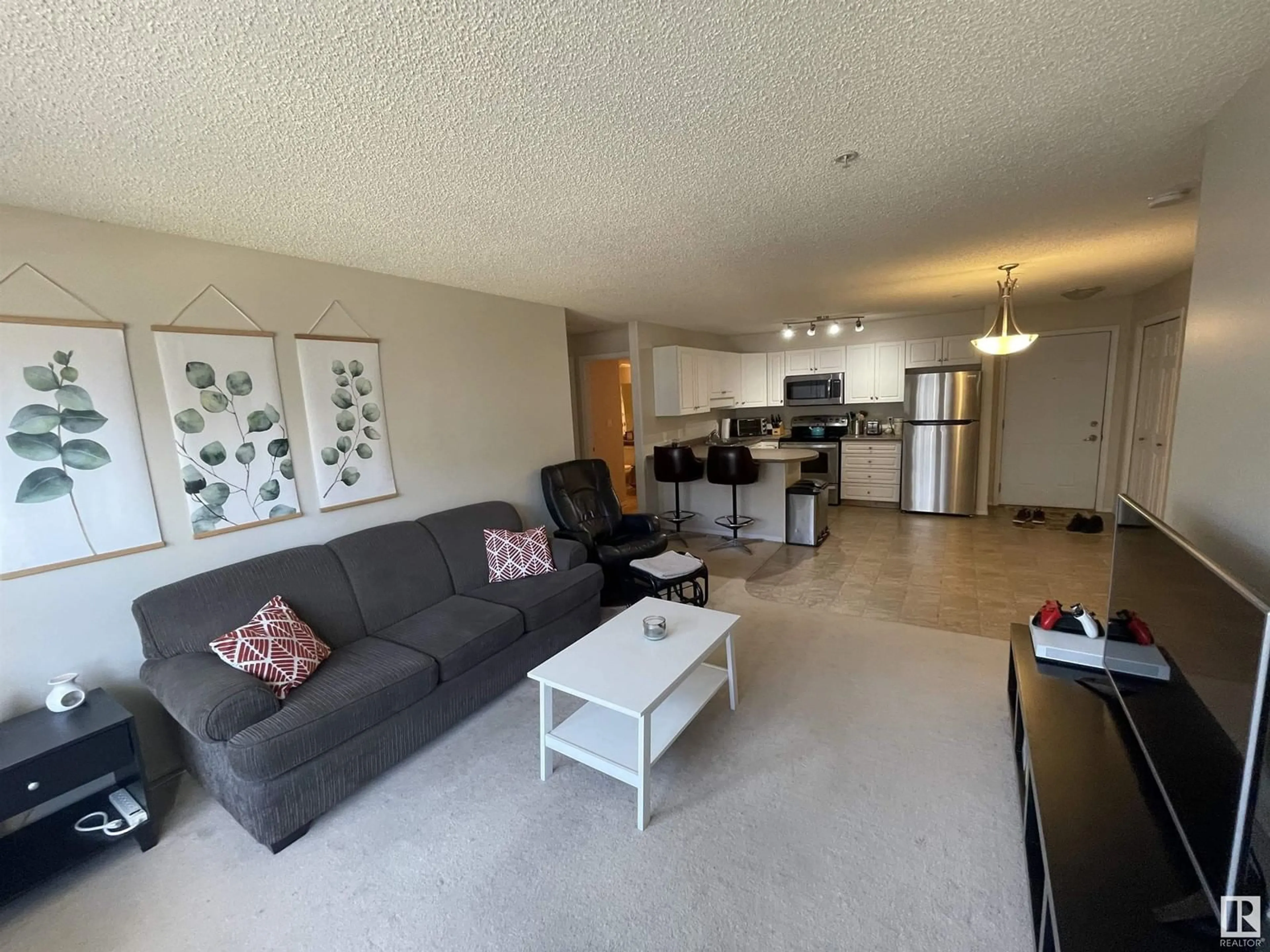 Living room with furniture, unknown for #210 13625 34 ST NW, Edmonton Alberta T5A0E3