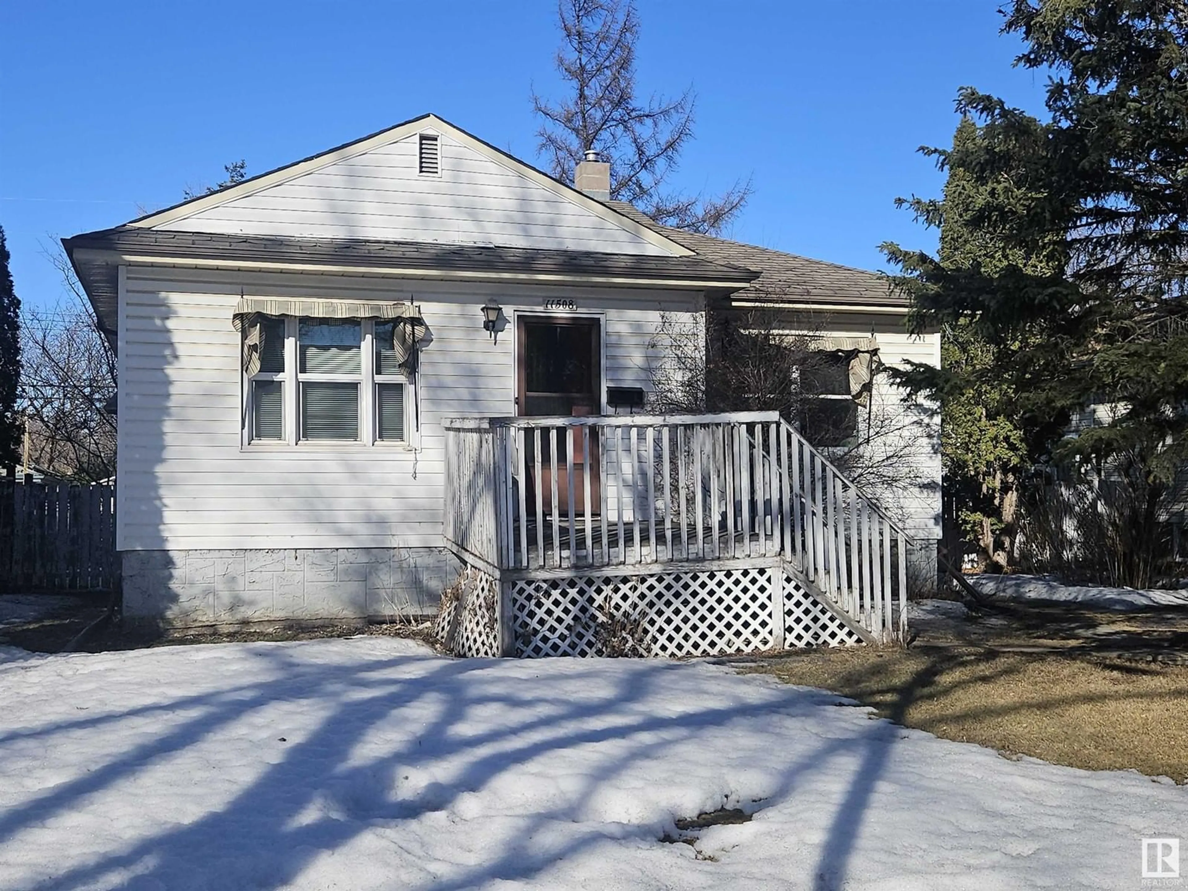 Home with vinyl exterior material, street for 11508 78 AV NW, Edmonton Alberta T6G0N5