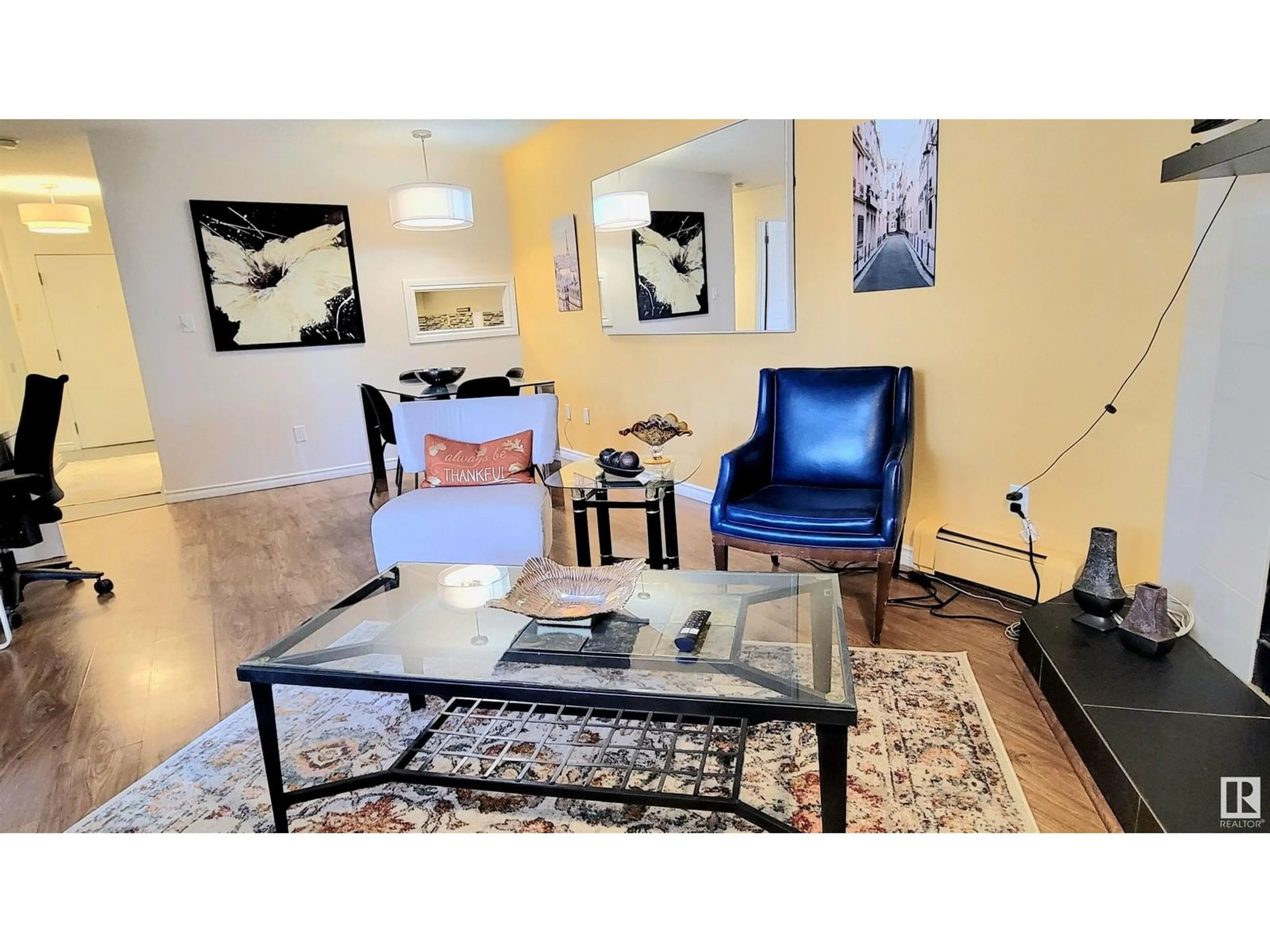 Living room with furniture, wood/laminate floor for #104 10138 116 ST NW, Edmonton Alberta T5K1V8