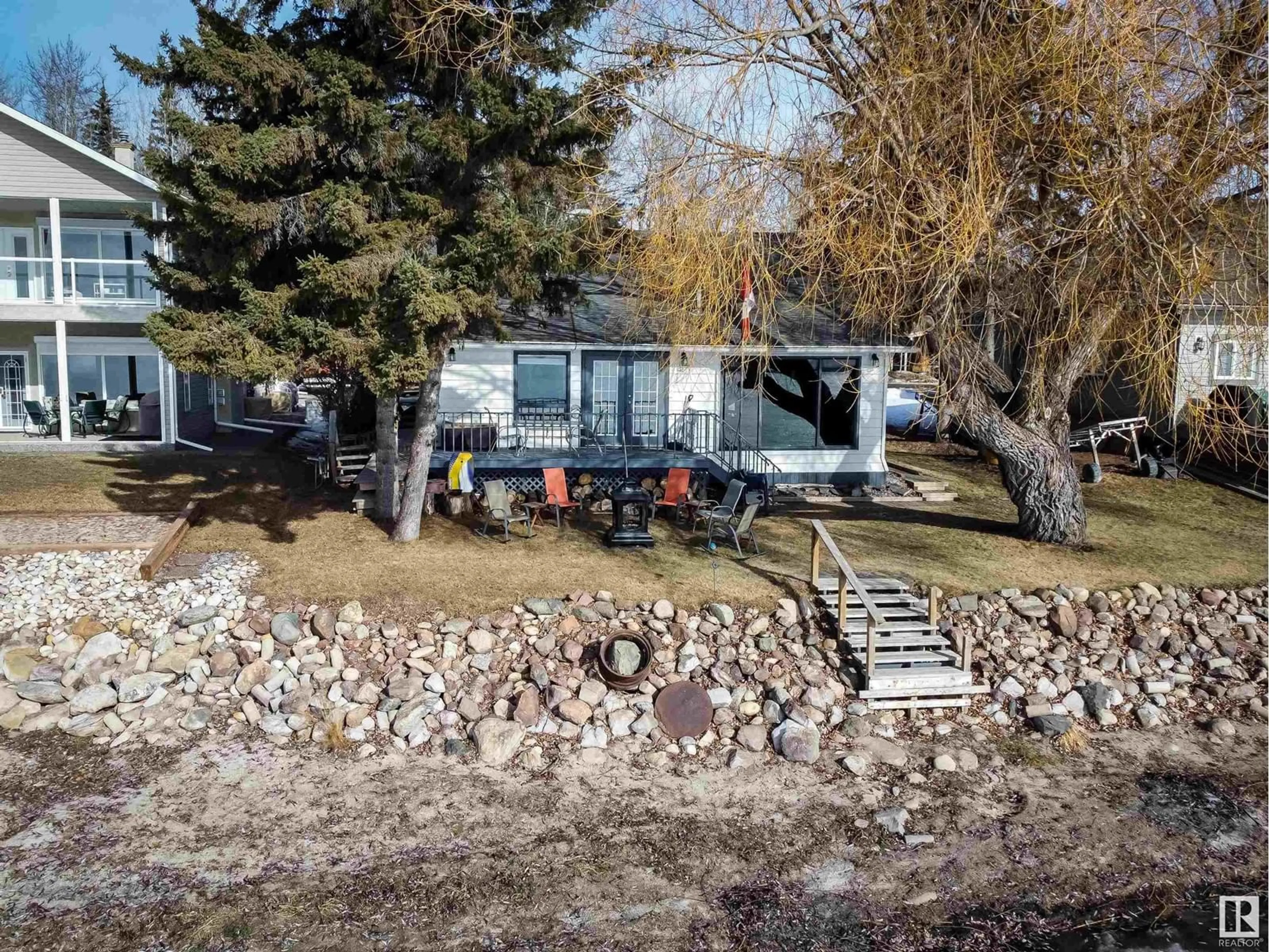 A pic from outside/outdoor area/front of a property/back of a property/a pic from drone, water/lake/river/ocean view for 707 7 ST, Rural Lac Ste. Anne County Alberta T0E1V0