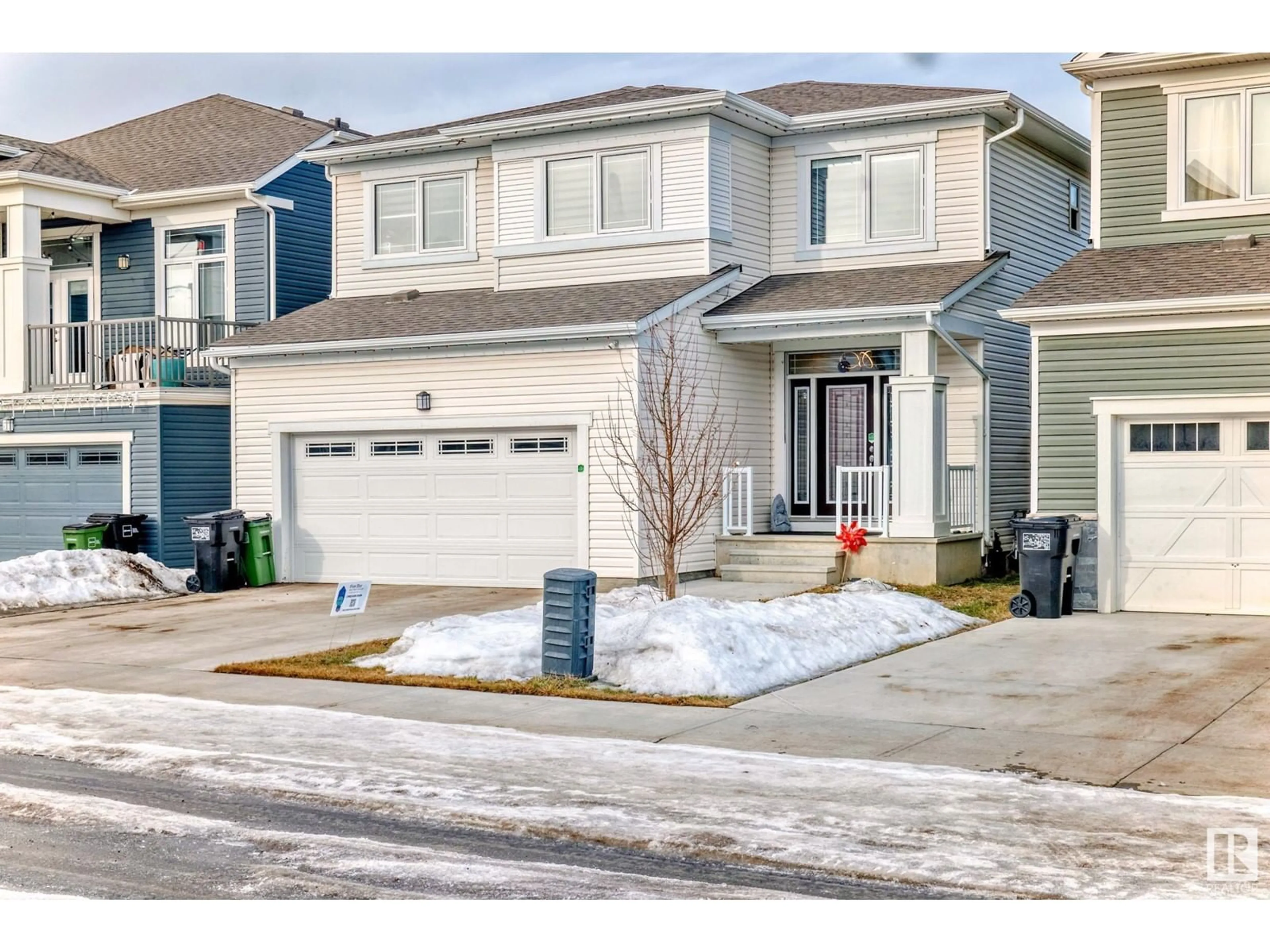 Home with vinyl exterior material, street for 1616 201 ST NW, Edmonton Alberta T6M0Y3