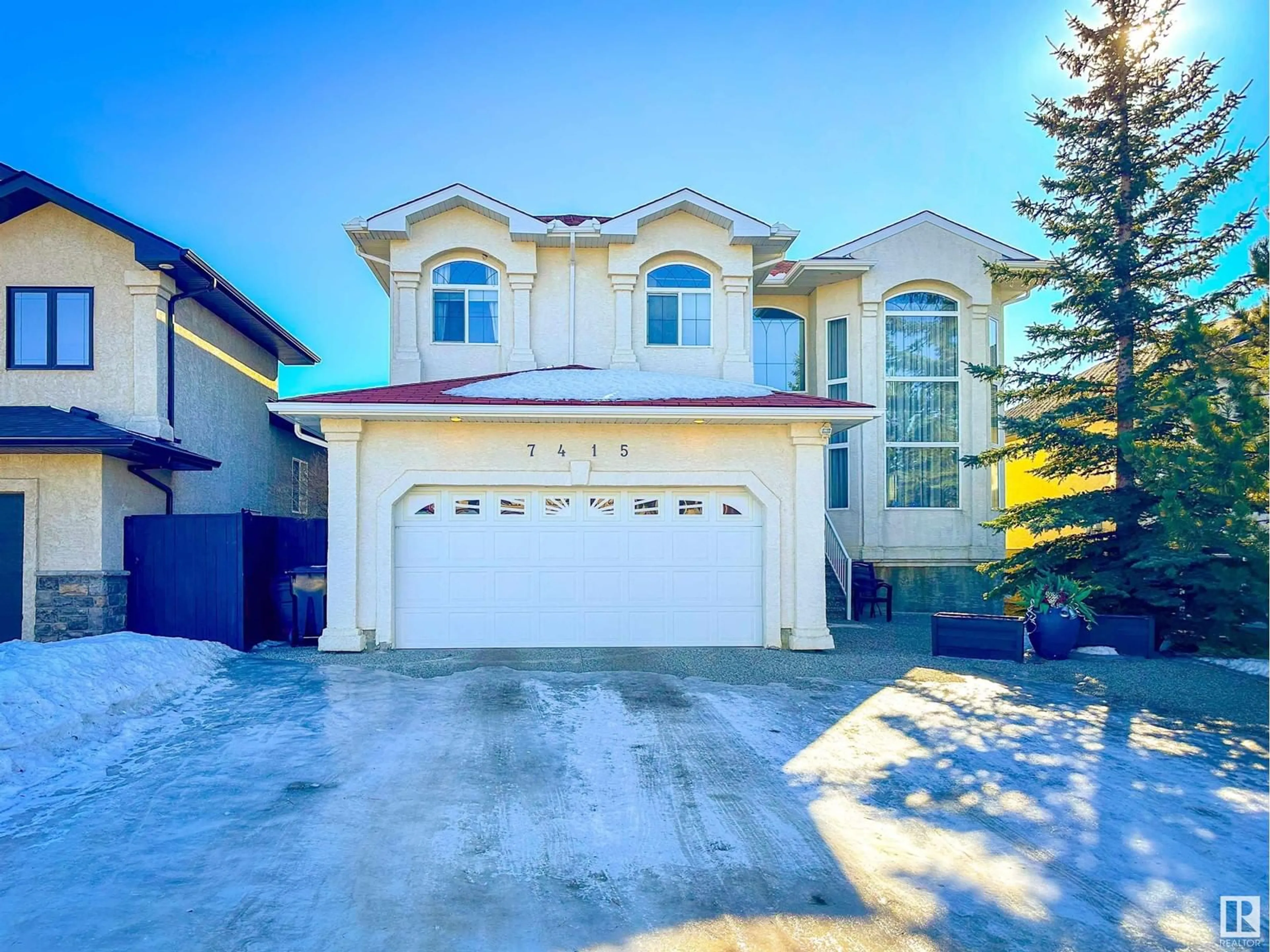 Home with vinyl exterior material, street for 7415 169 AV NW, Edmonton Alberta T5Z0A3