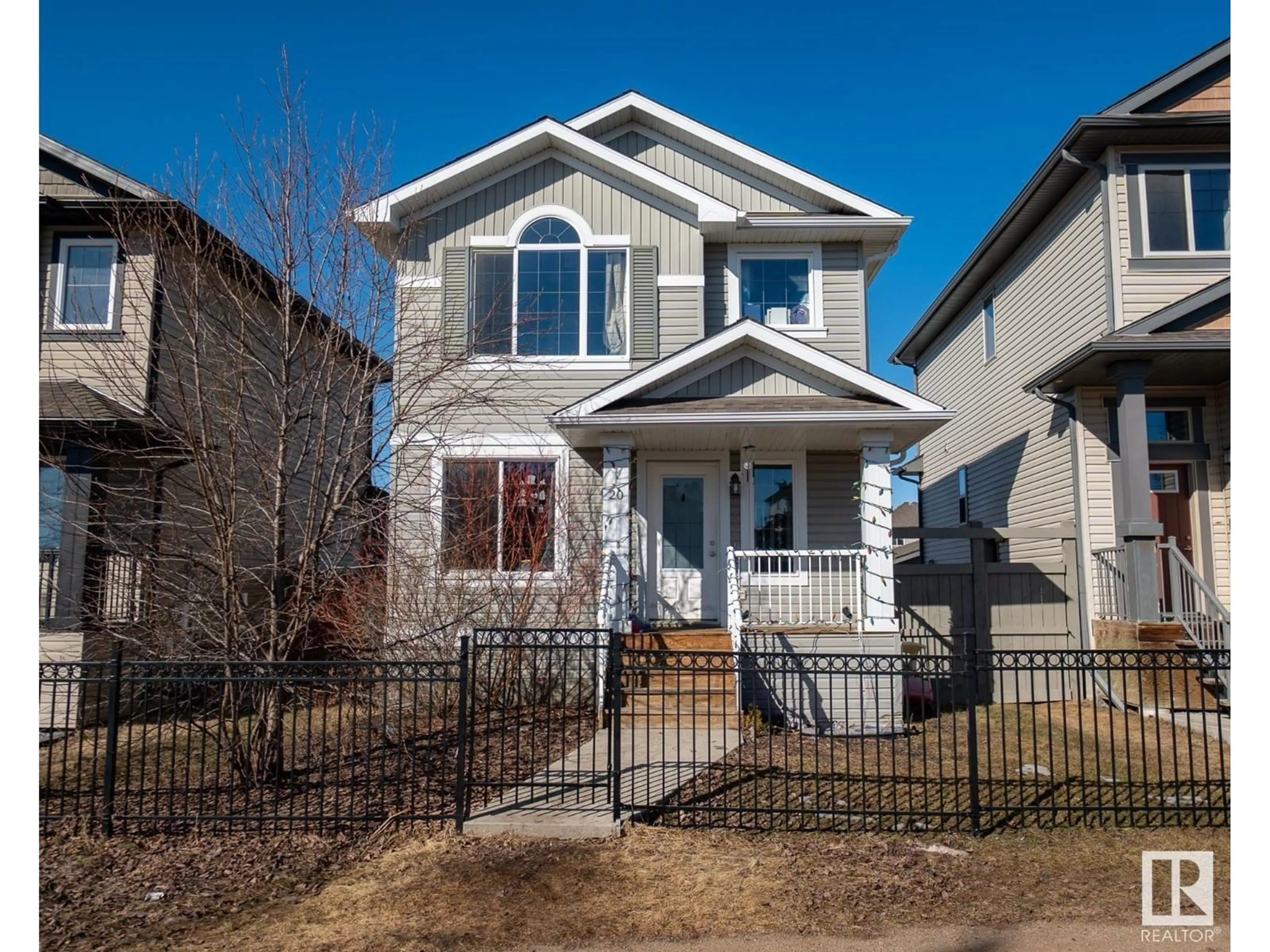 Home with vinyl exterior material, street for 20 SPRUCE BOULEVARD, Leduc Alberta T9E0W4