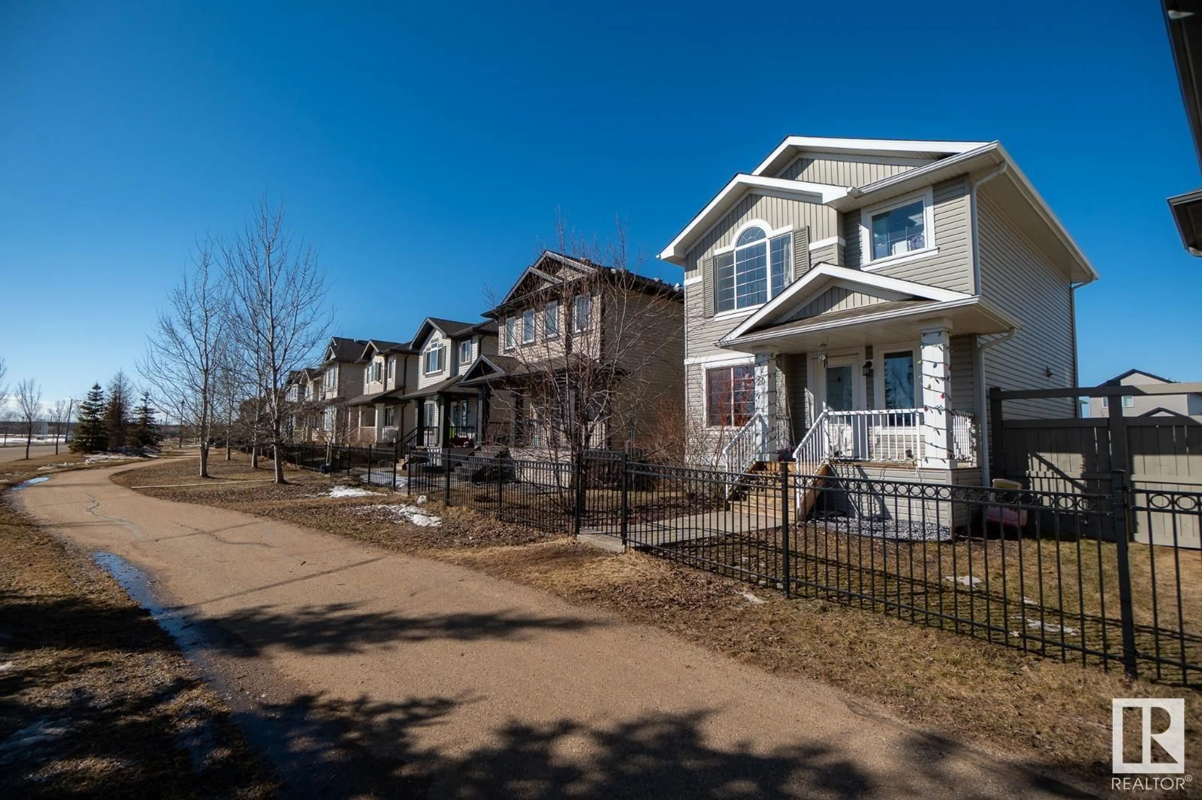 Home with vinyl exterior material, street for #20 Spruce Boulevard, Leduc Alberta T9E0W4