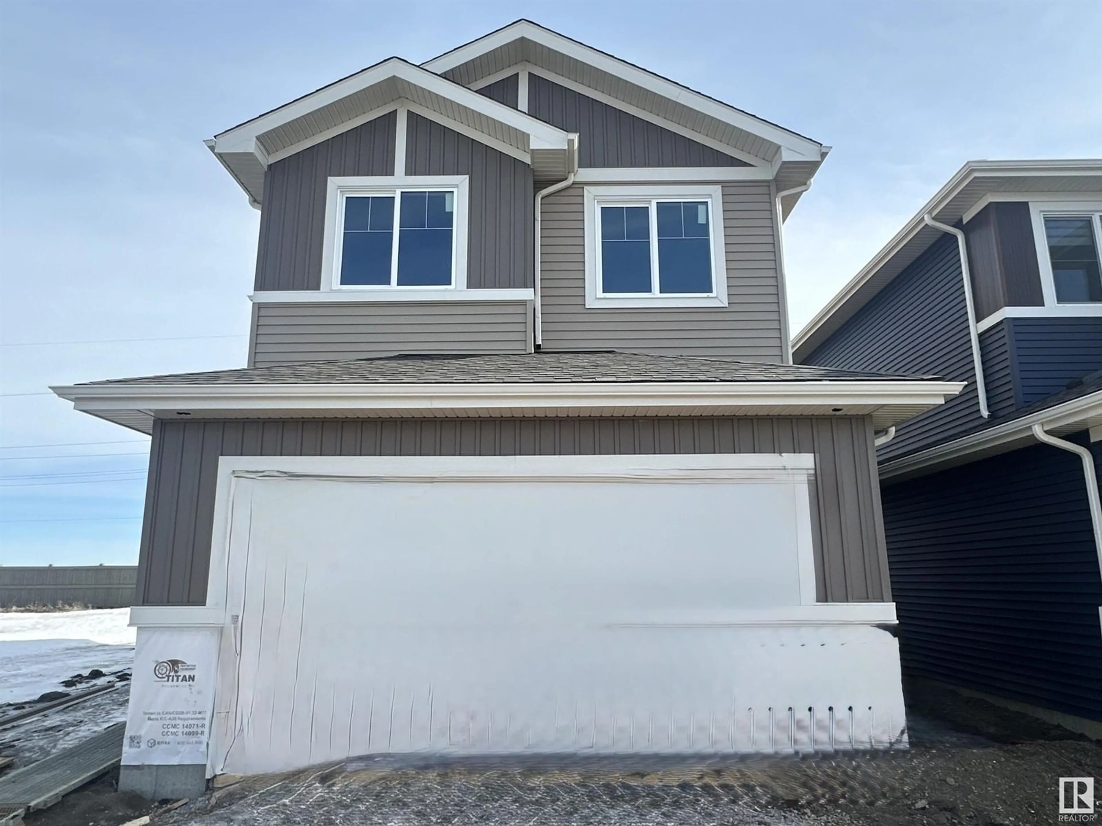 Home with vinyl exterior material, street for 9 SCORIA WD, Fort Saskatchewan Alberta T8L0Z1