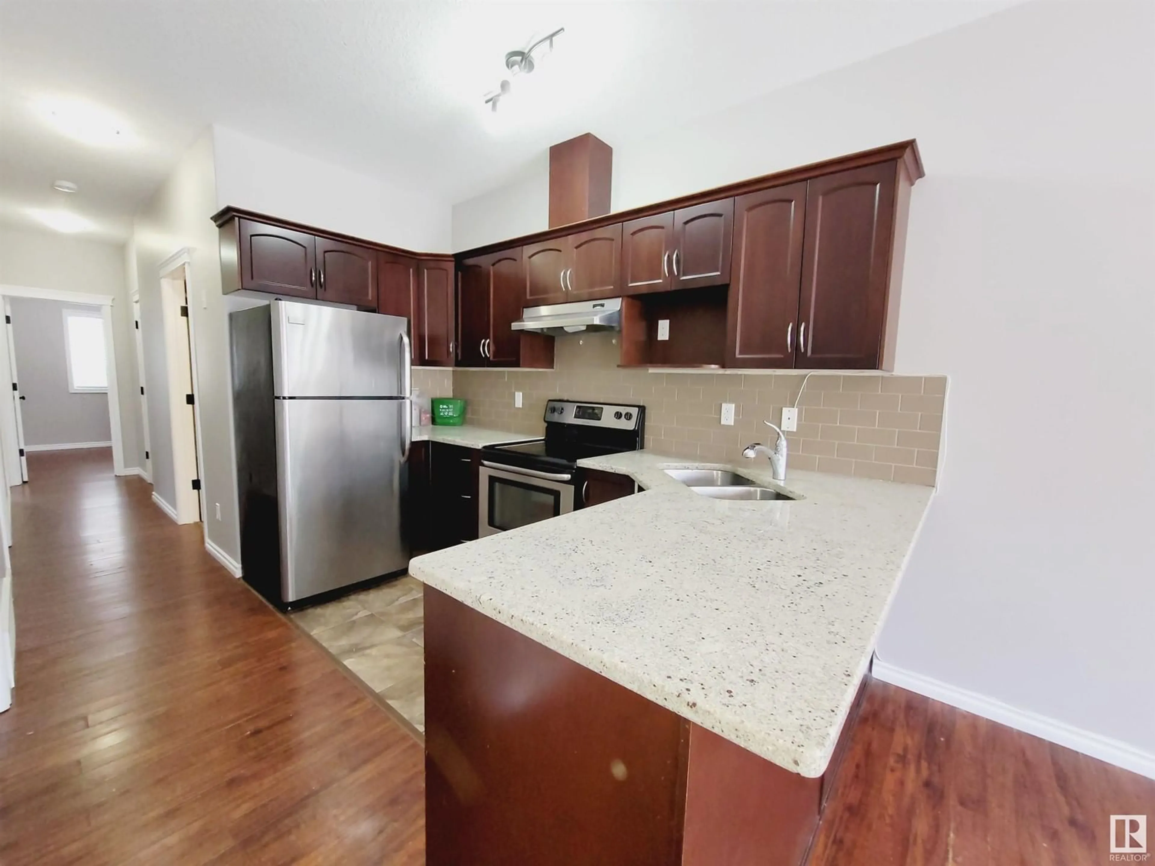 Open concept kitchen, wood/laminate floor for NW - 10220 150 ST, Edmonton Alberta T5T1P3