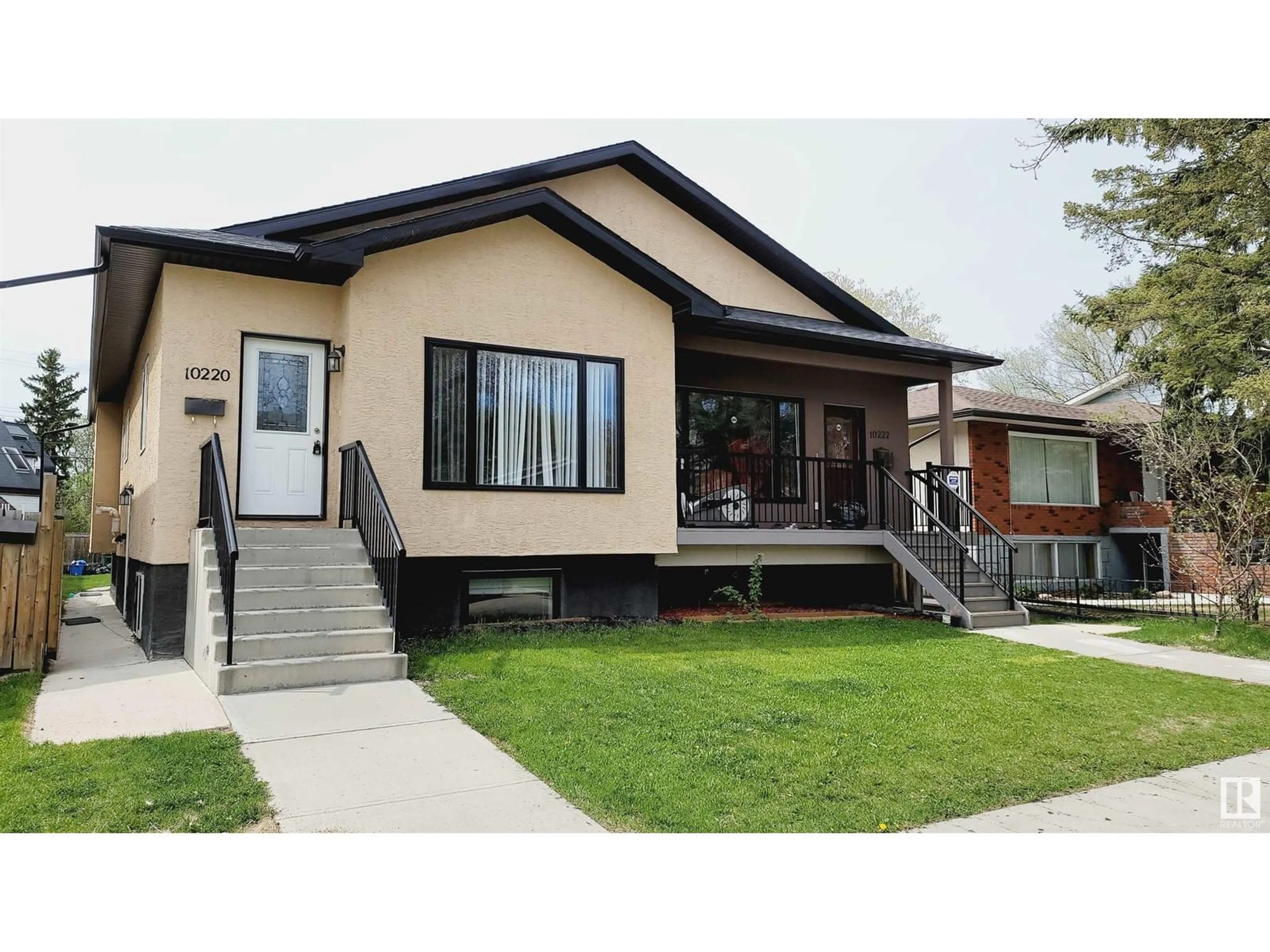 Home with vinyl exterior material, street for 10220 150 ST NW, Edmonton Alberta T5T1P3