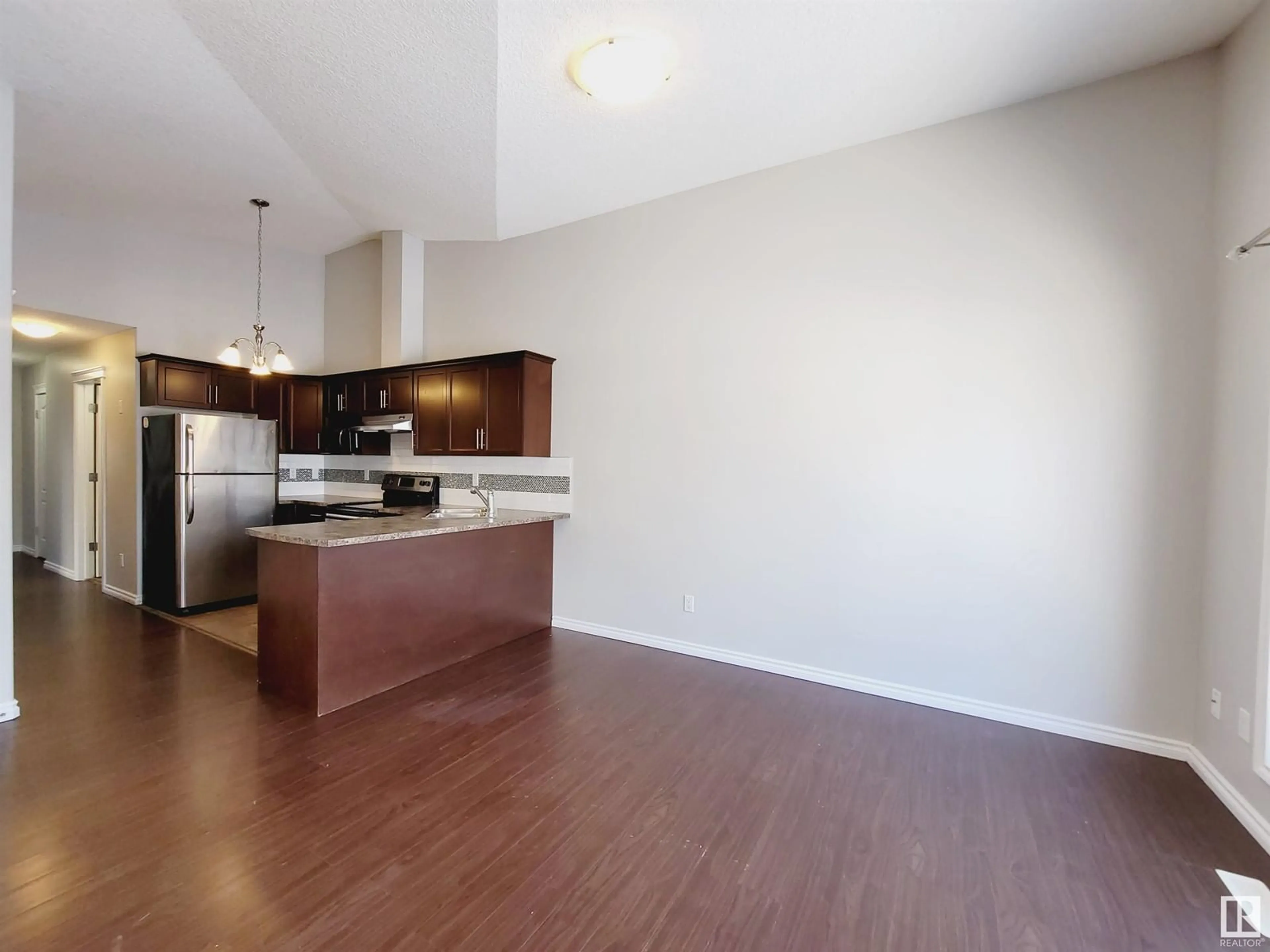 Open concept kitchen, wood/laminate floor for 12121 124 ST NW, Edmonton Alberta T5L0N1