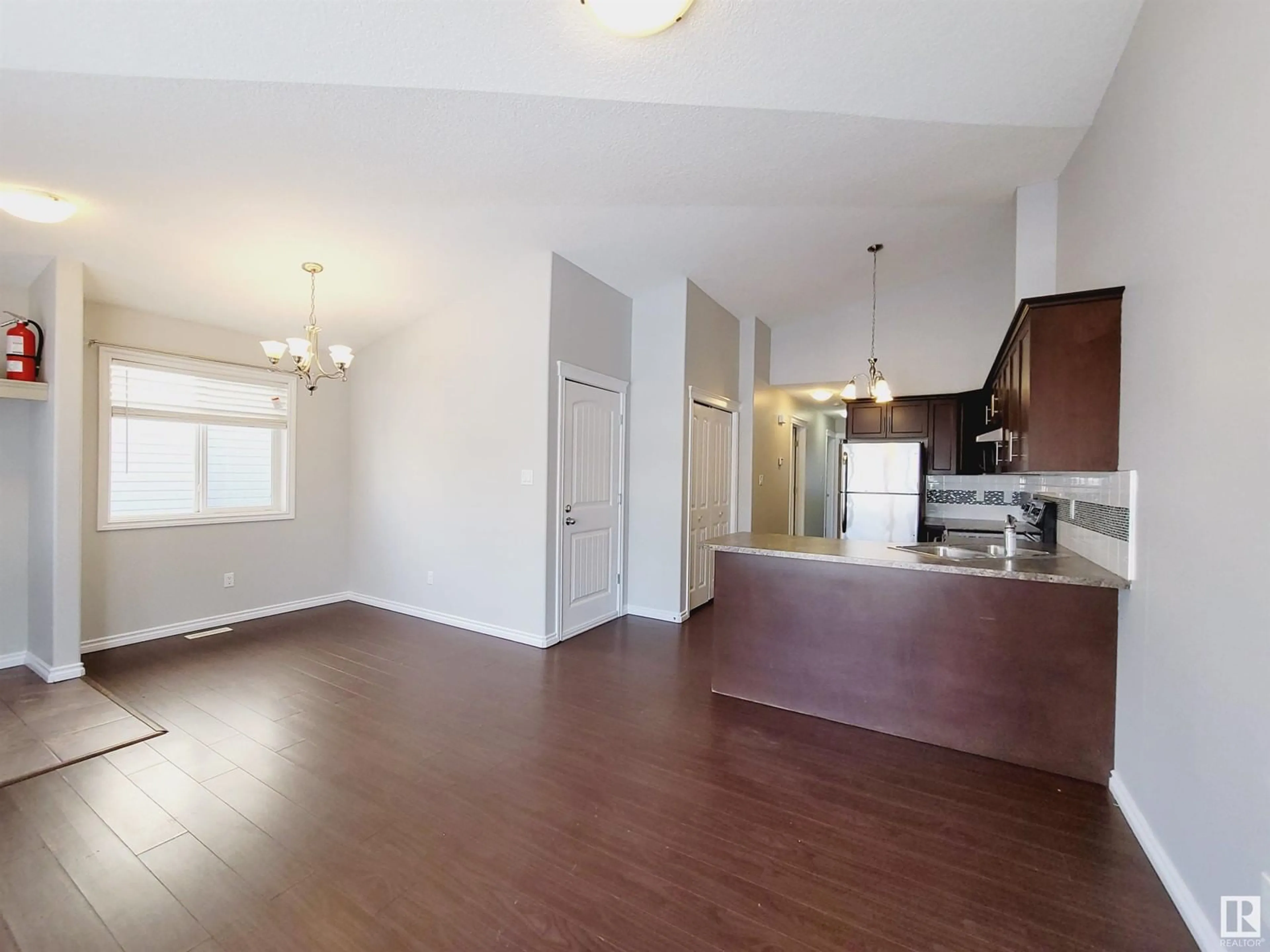 Open concept kitchen, wood/laminate floor for 12121 124 ST NW, Edmonton Alberta T5L0N1