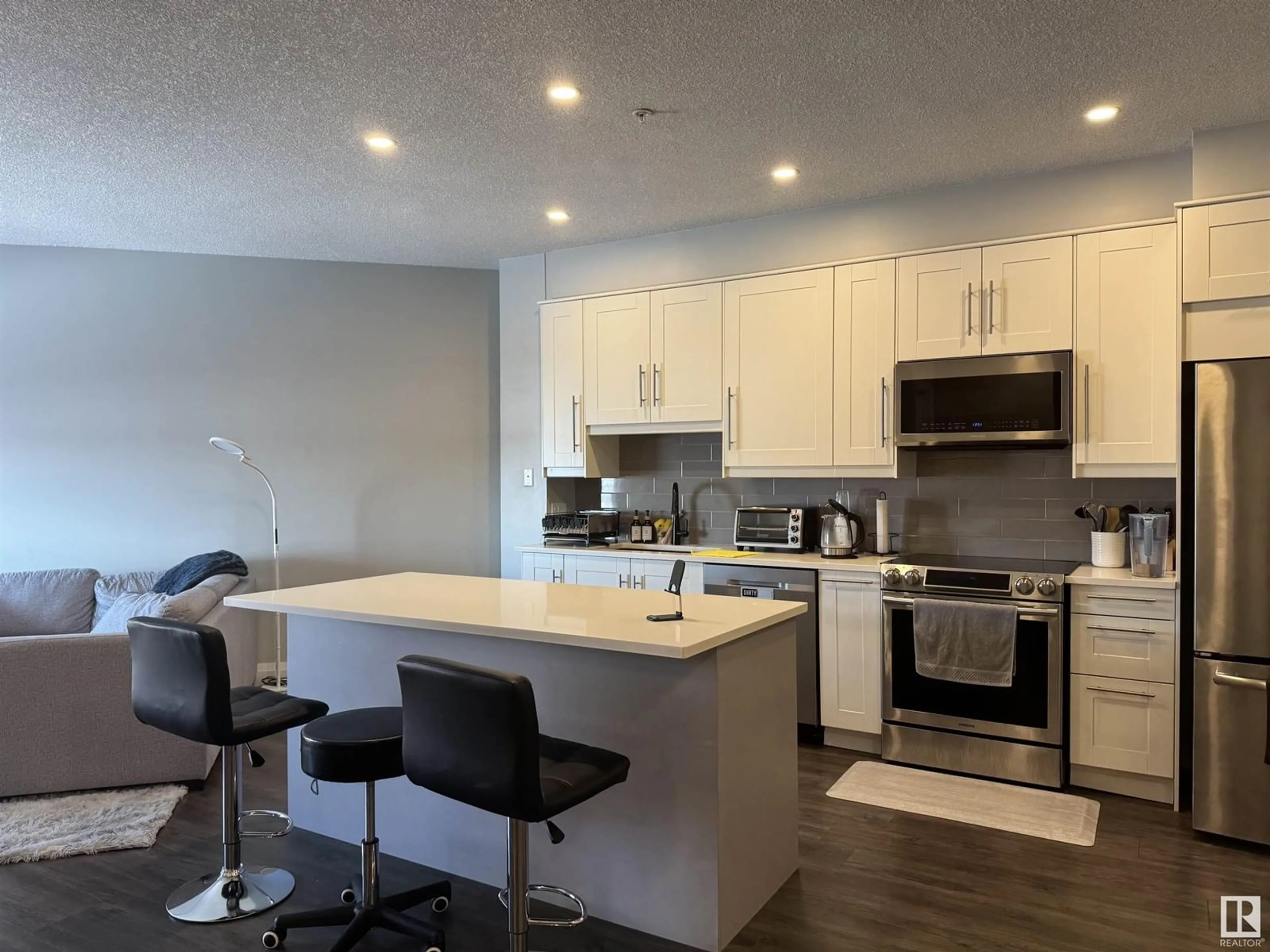 Open concept kitchen, wood/laminate floor for #405 - 263 MACEWAN RD, Edmonton Alberta T6W0C4