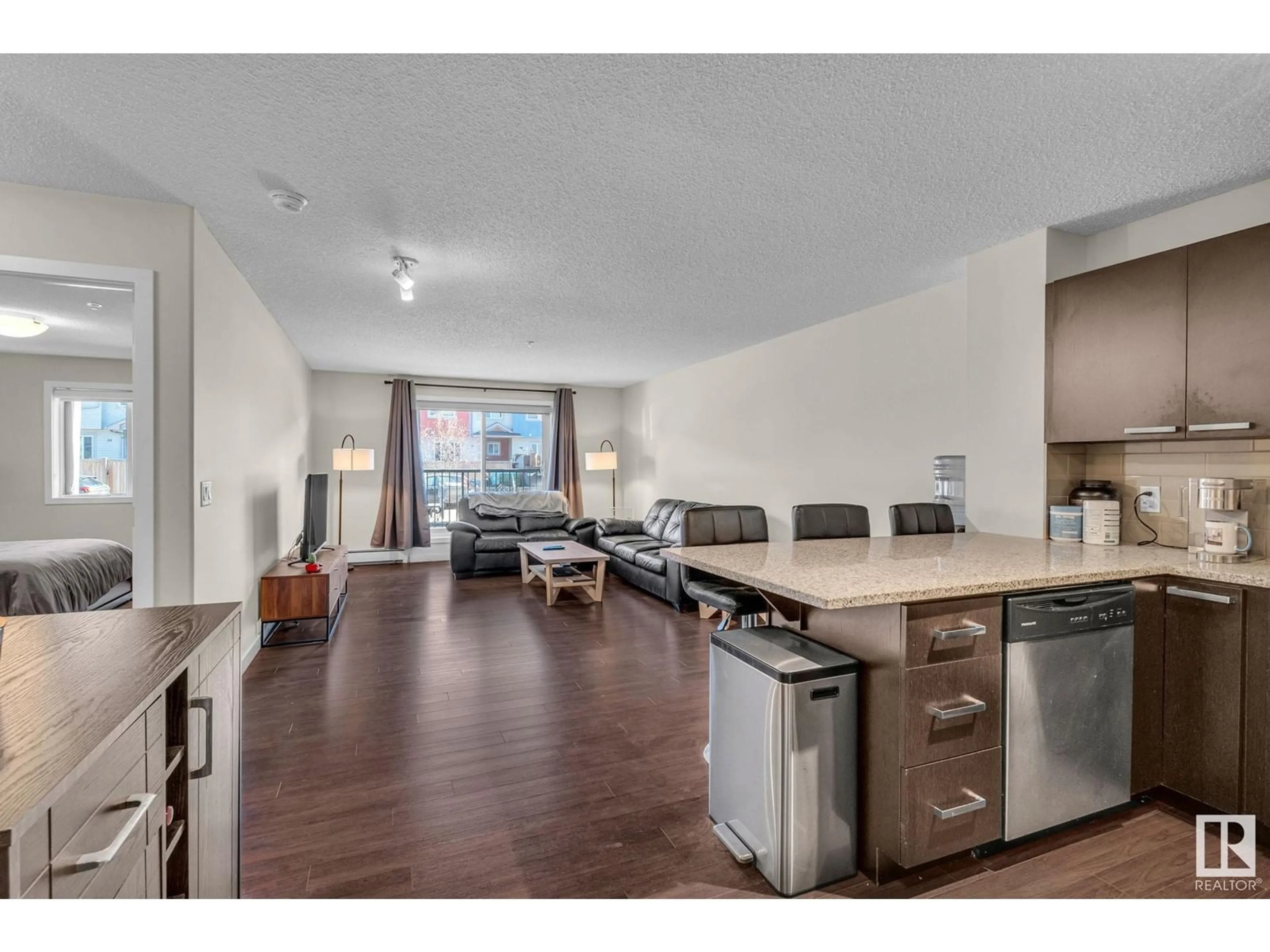 Open concept kitchen, unknown for #106 - 14808 125 ST, Edmonton Alberta T5X0G1