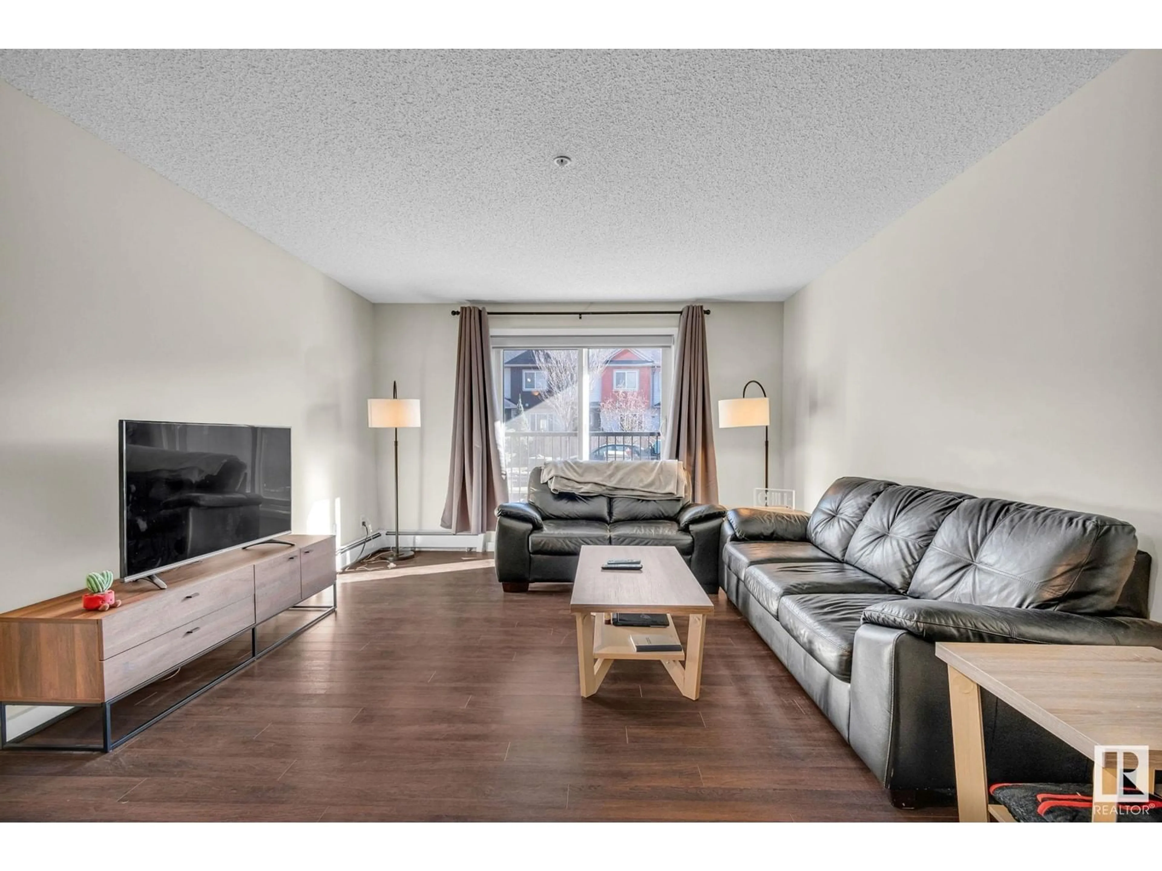 Living room with furniture, wood/laminate floor for #106 - 14808 125 ST, Edmonton Alberta T5X0G1