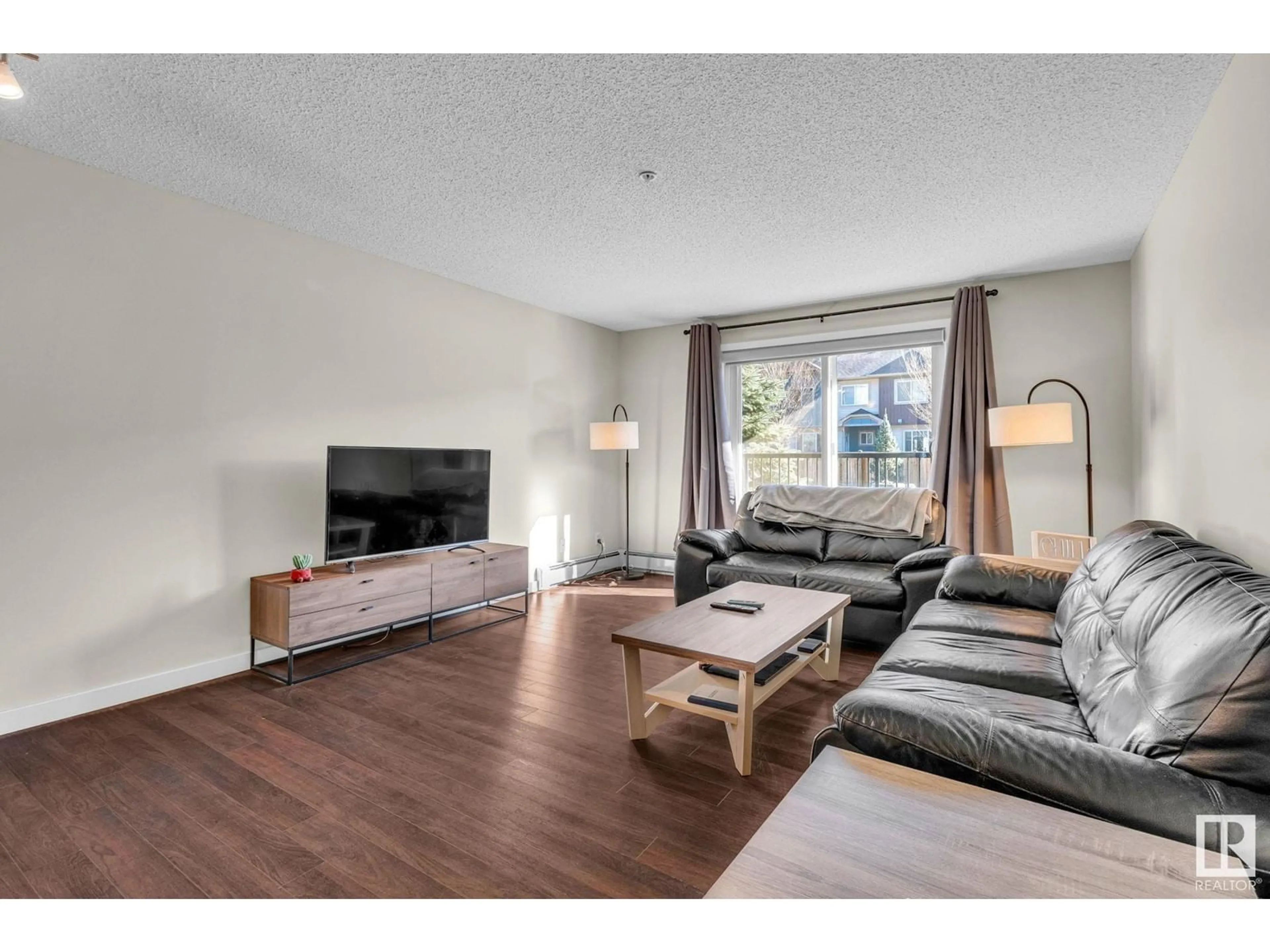 Living room with furniture, wood/laminate floor for #106 - 14808 125 ST, Edmonton Alberta T5X0G1