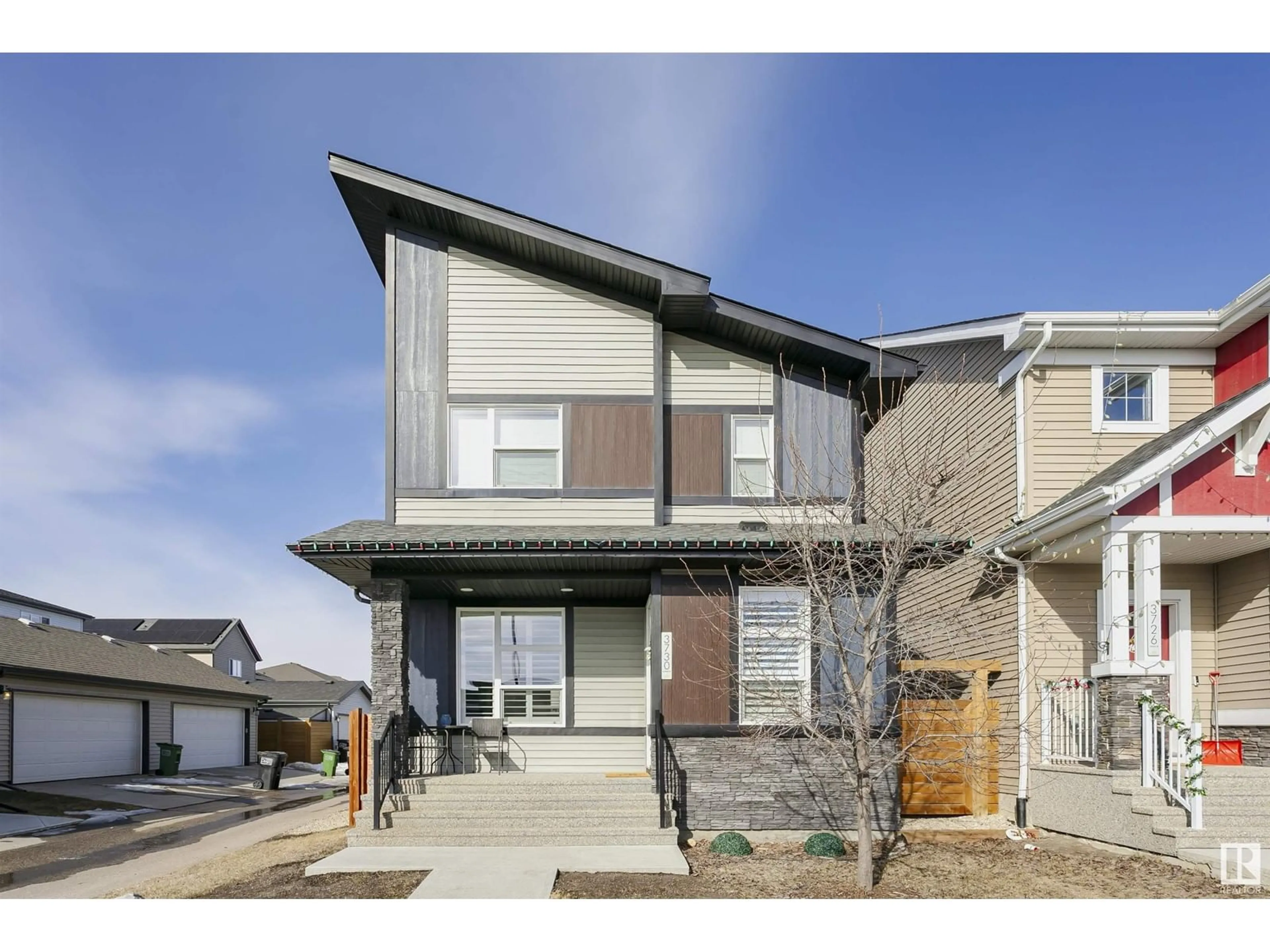 Home with vinyl exterior material, street for 3730 8 AV SW, Edmonton Alberta T6X2G6