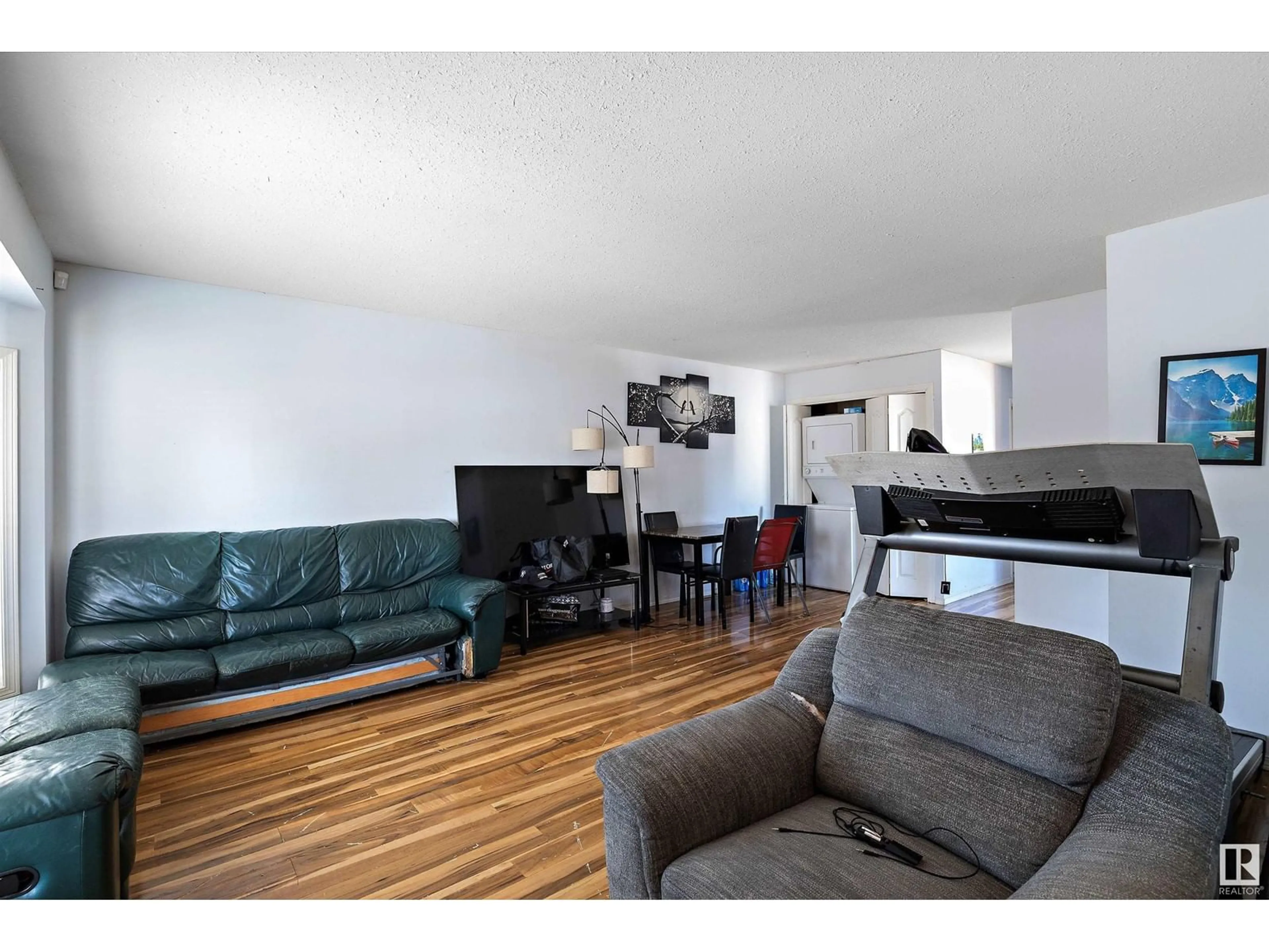 Living room with furniture, wood/laminate floor for 12828 125 ST NW, Edmonton Alberta T5L0T9