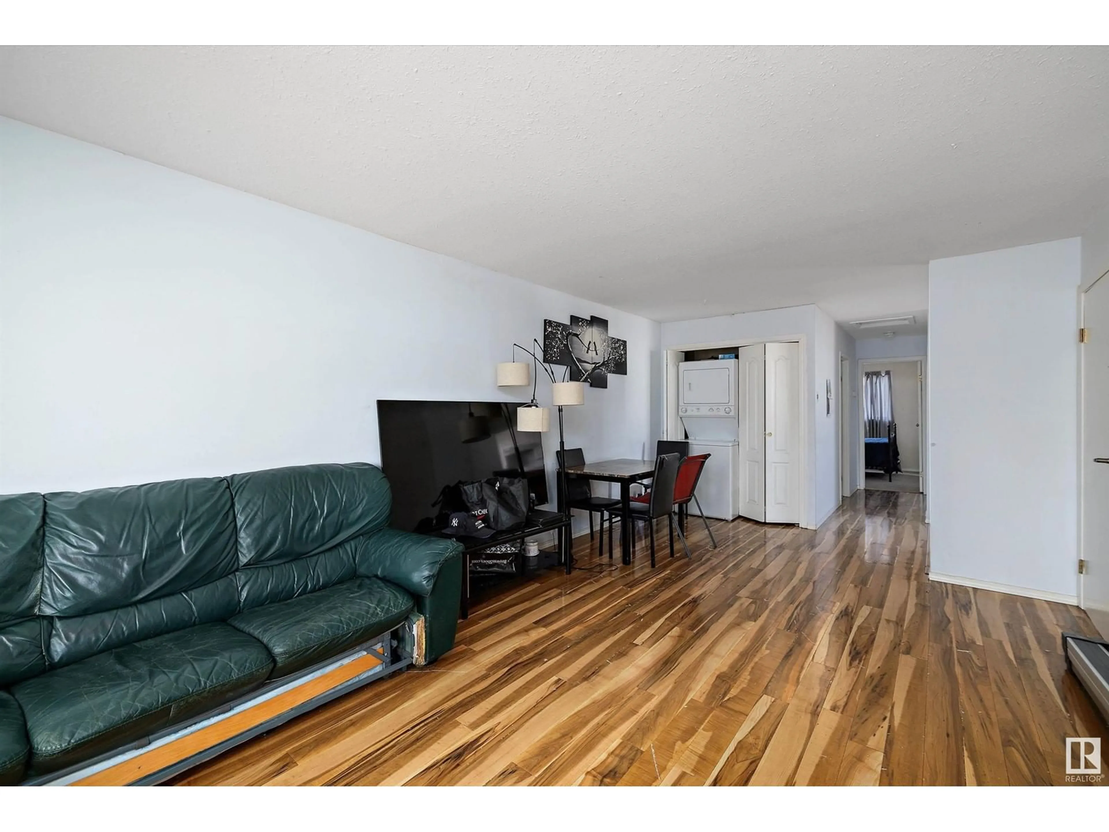 Living room with furniture, wood/laminate floor for 12828 125 ST NW, Edmonton Alberta T5L0T9