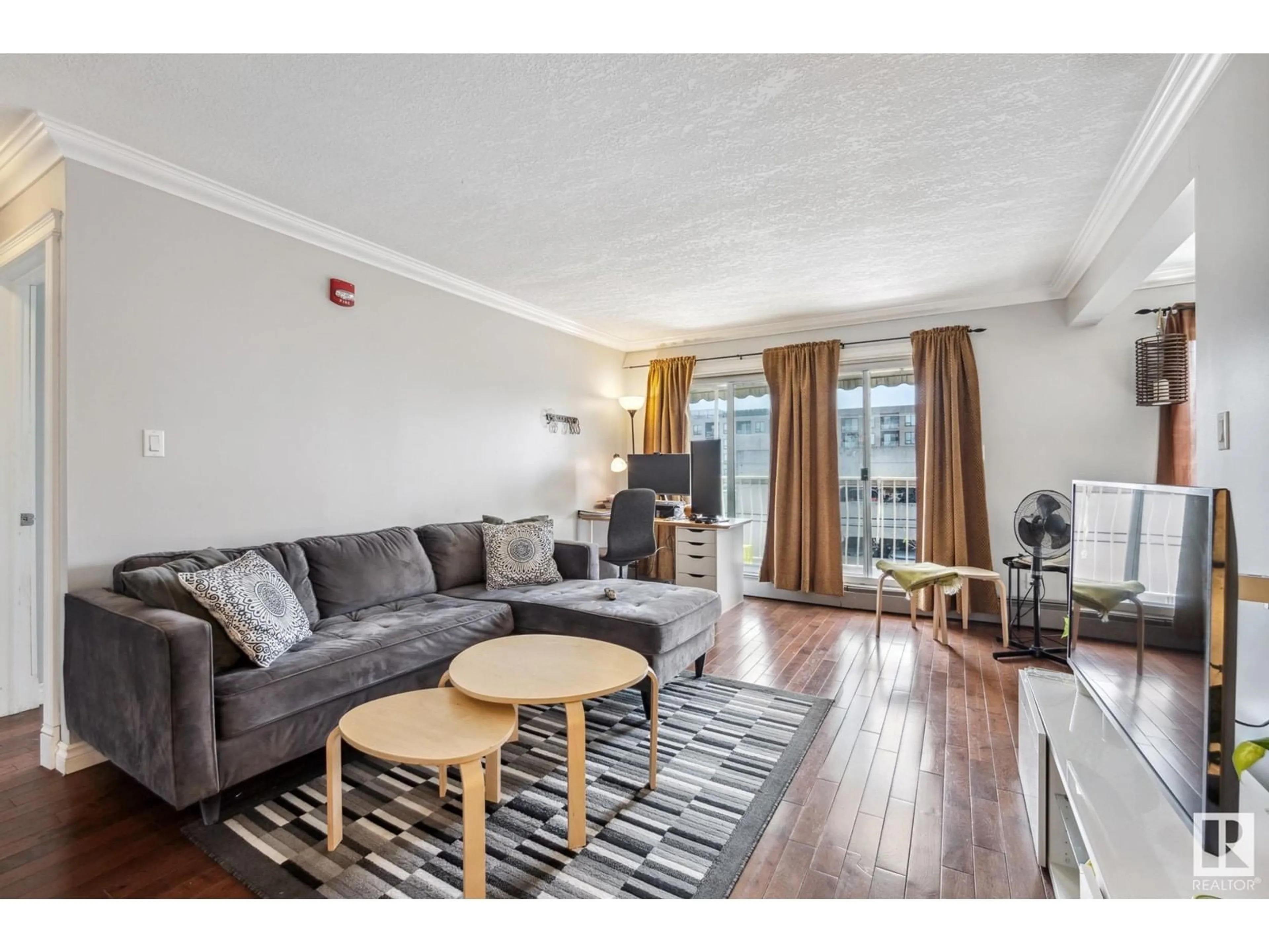 Living room with furniture, wood/laminate floor for #403 10625 83 AV NW, Edmonton Alberta T6E2E3