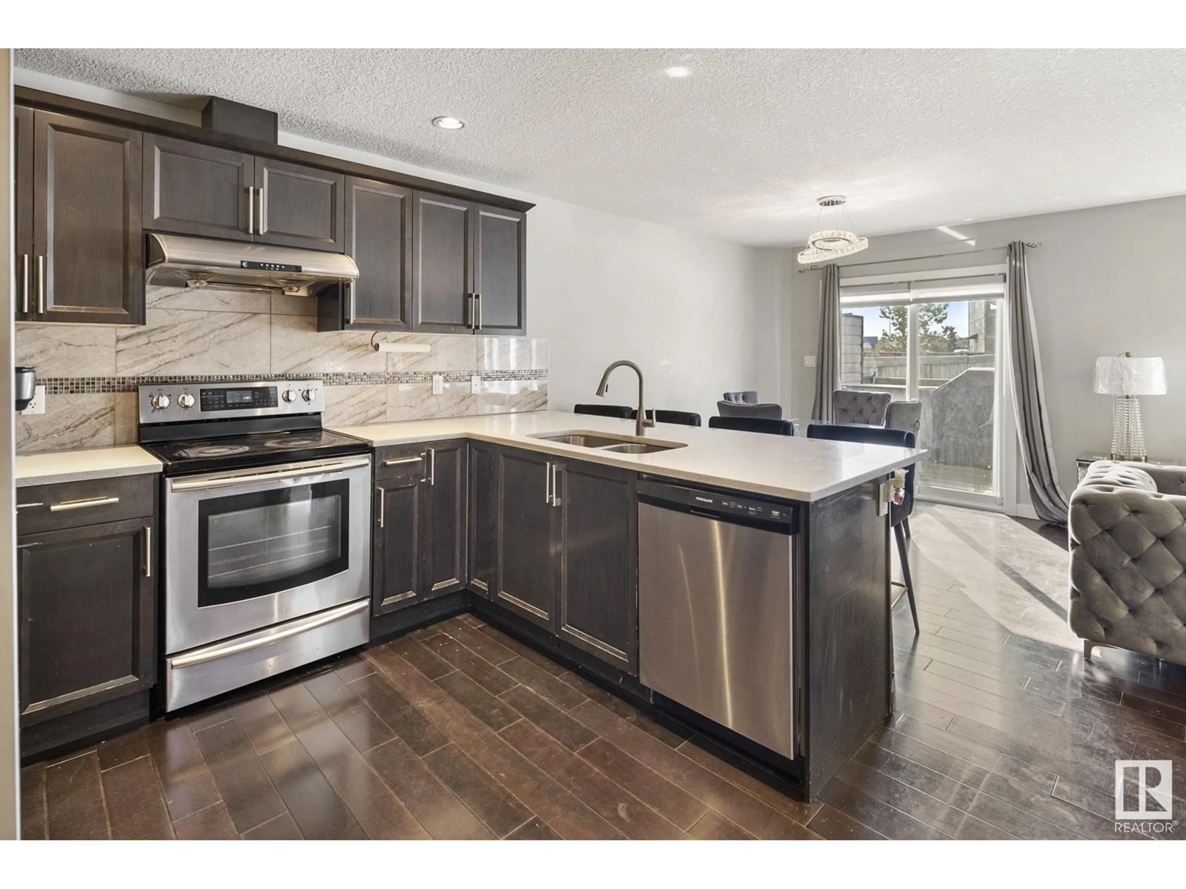 Open concept kitchen, ceramic/tile floor for 5951 167C AV NW, Edmonton Alberta T5Y0P4