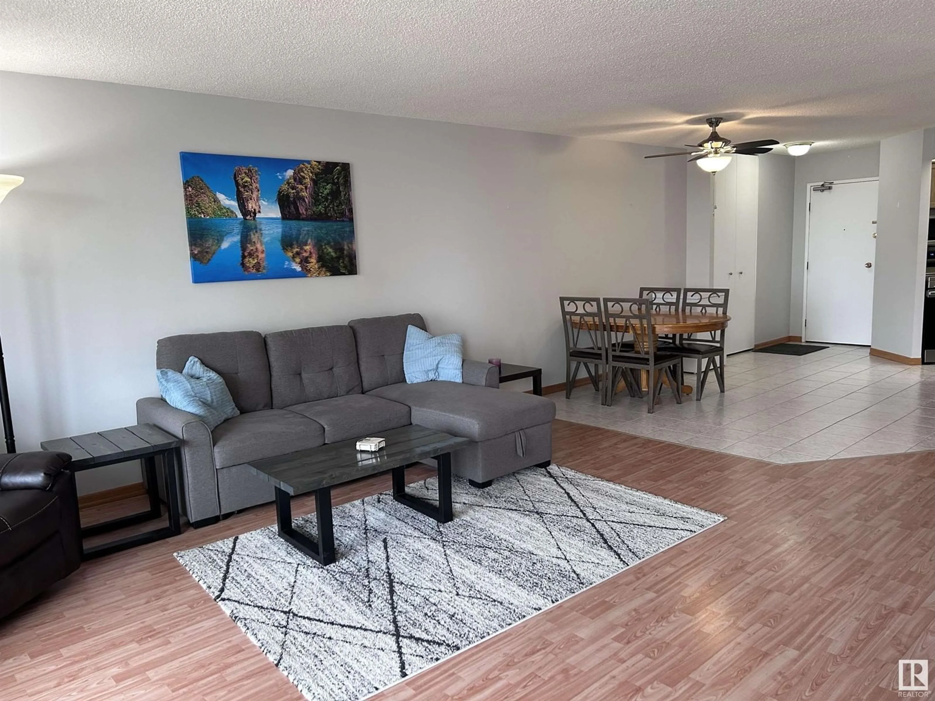 Living room with furniture, wood/laminate floor for #406 10045 117 ST NW, Edmonton Alberta T5K1W8