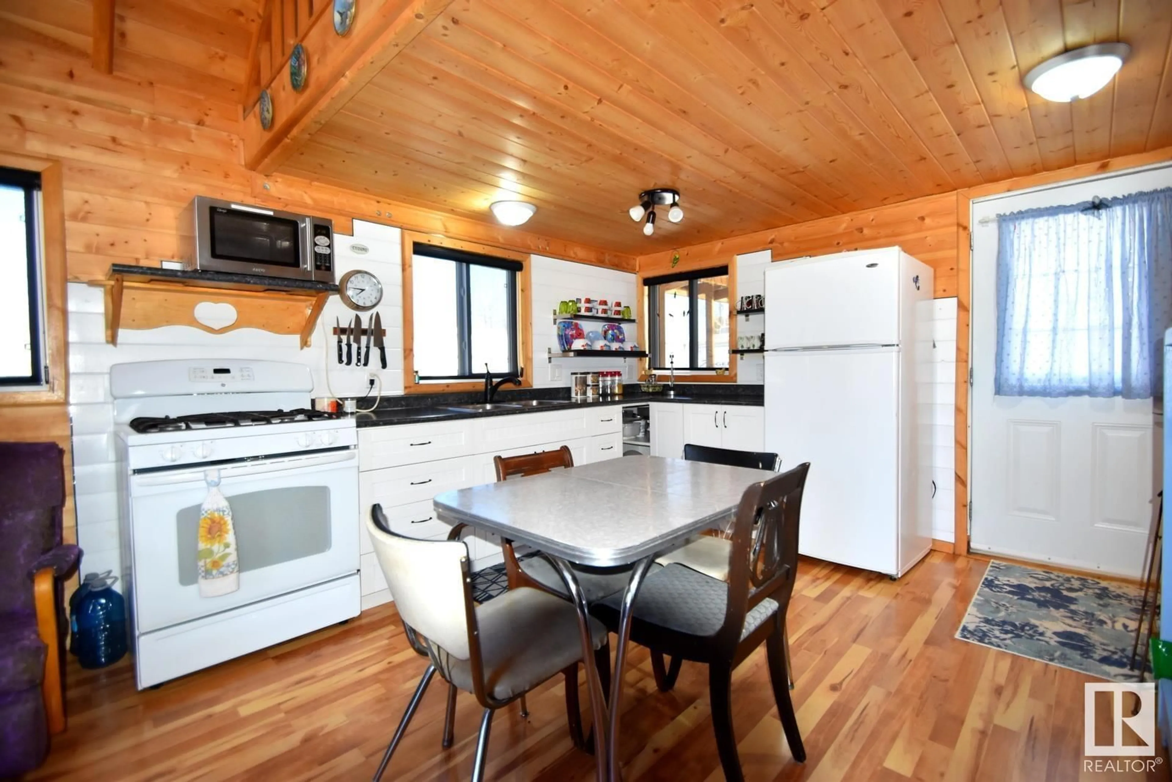 Open concept kitchen, wood/laminate floor for 7 Giblak Heights North Buck Lake, Rural Athabasca County Alberta T0A0M0