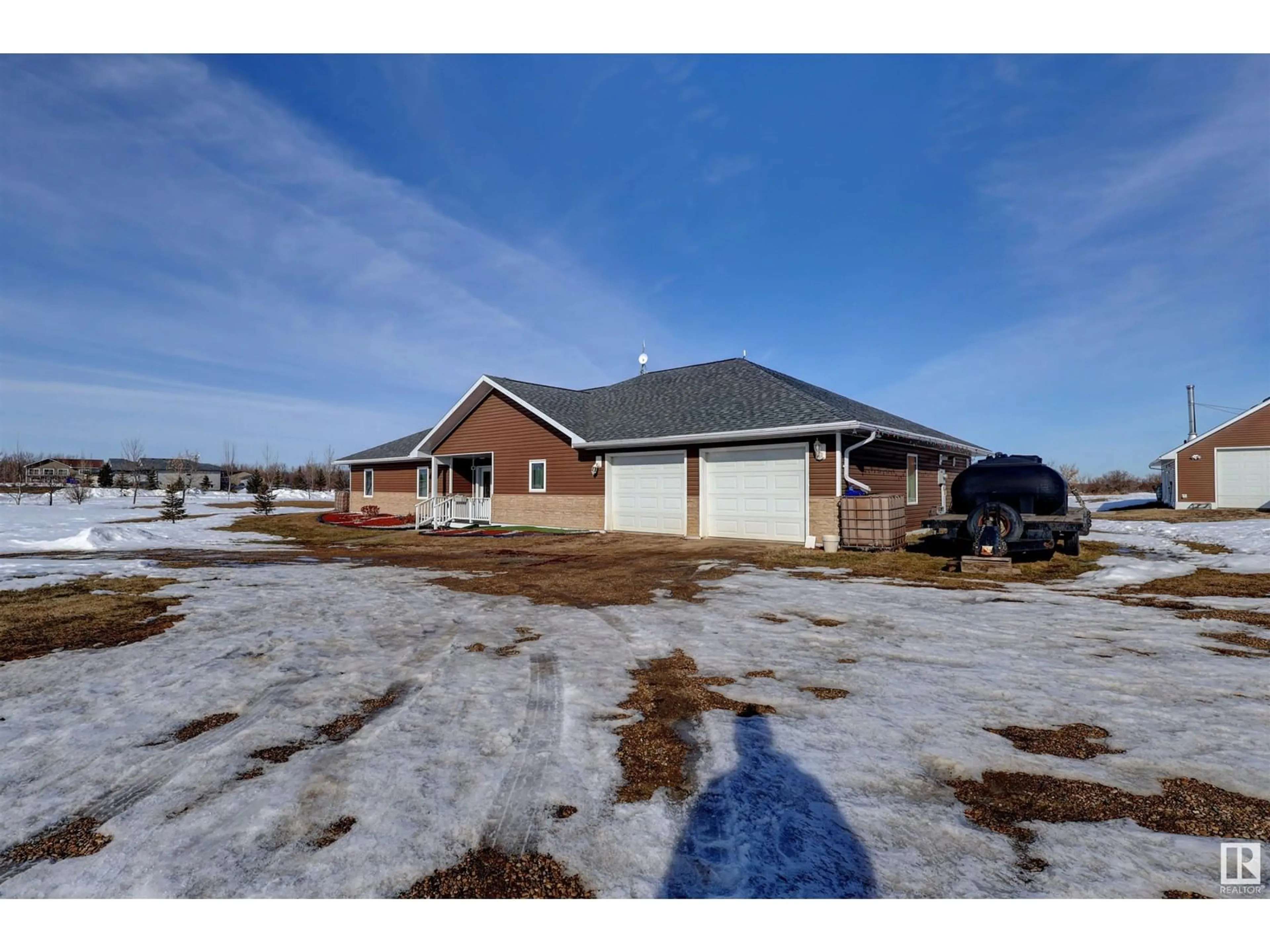 A pic from outside/outdoor area/front of a property/back of a property/a pic from drone, unknown for #60 50074 RGE ROAD 233 SW, Rural Leduc County Alberta T4X0L2