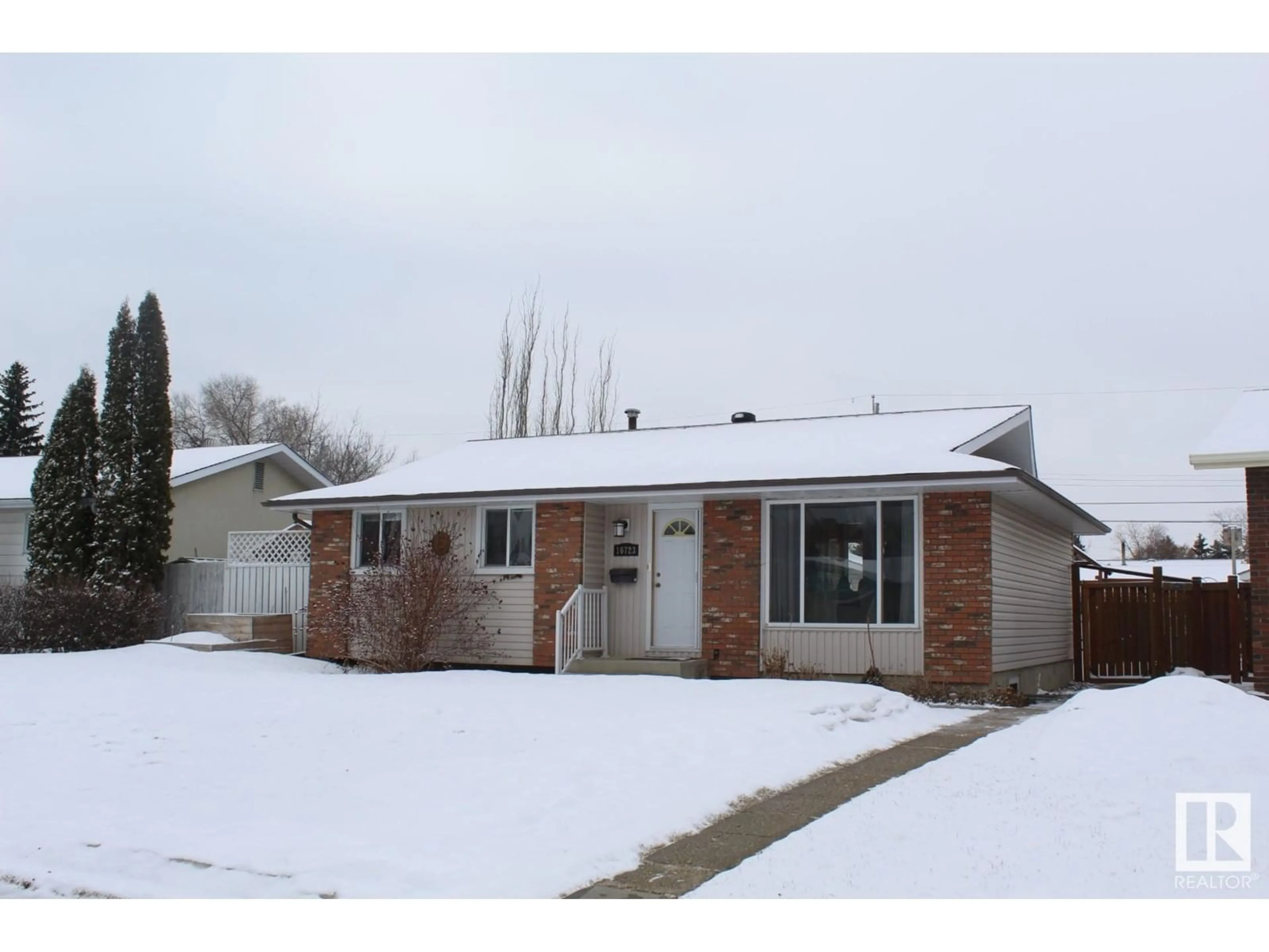 Home with brick exterior material, street for 16723 81 AV NW, Edmonton Alberta T5R3P8