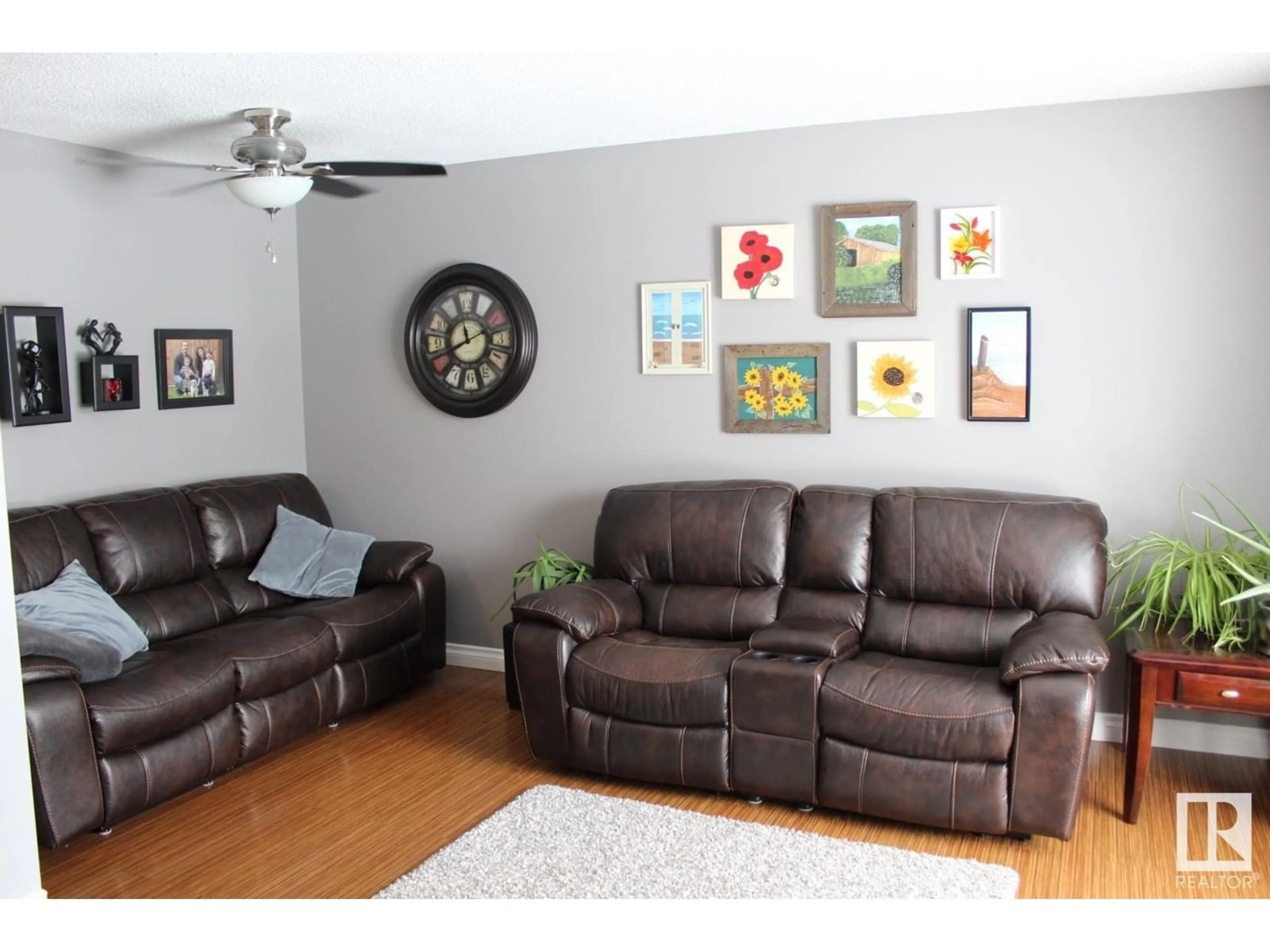 Living room with furniture, wood/laminate floor for 16723 81 AV NW, Edmonton Alberta T5R3P8