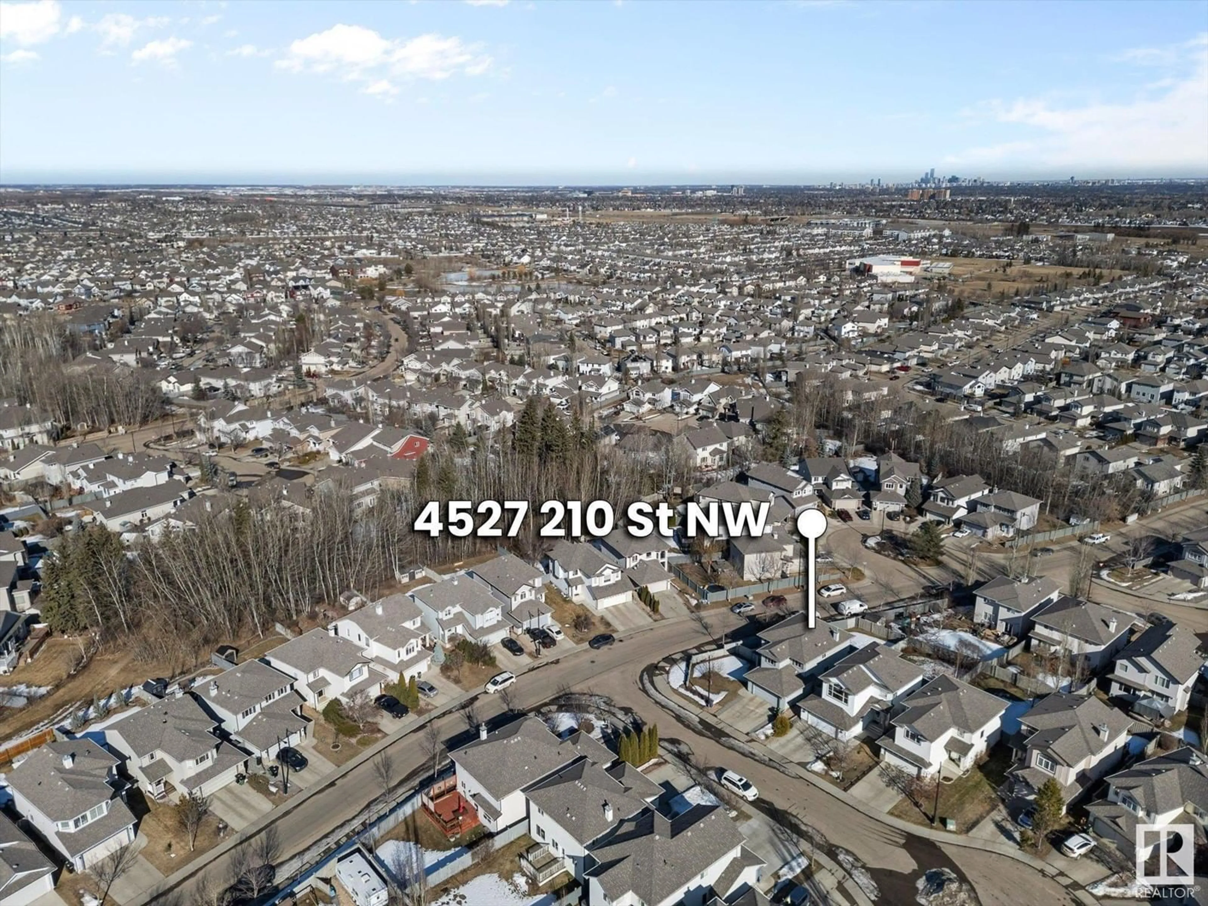 A pic from outside/outdoor area/front of a property/back of a property/a pic from drone, street for 4527 210 ST NW, Edmonton Alberta T6M0G5