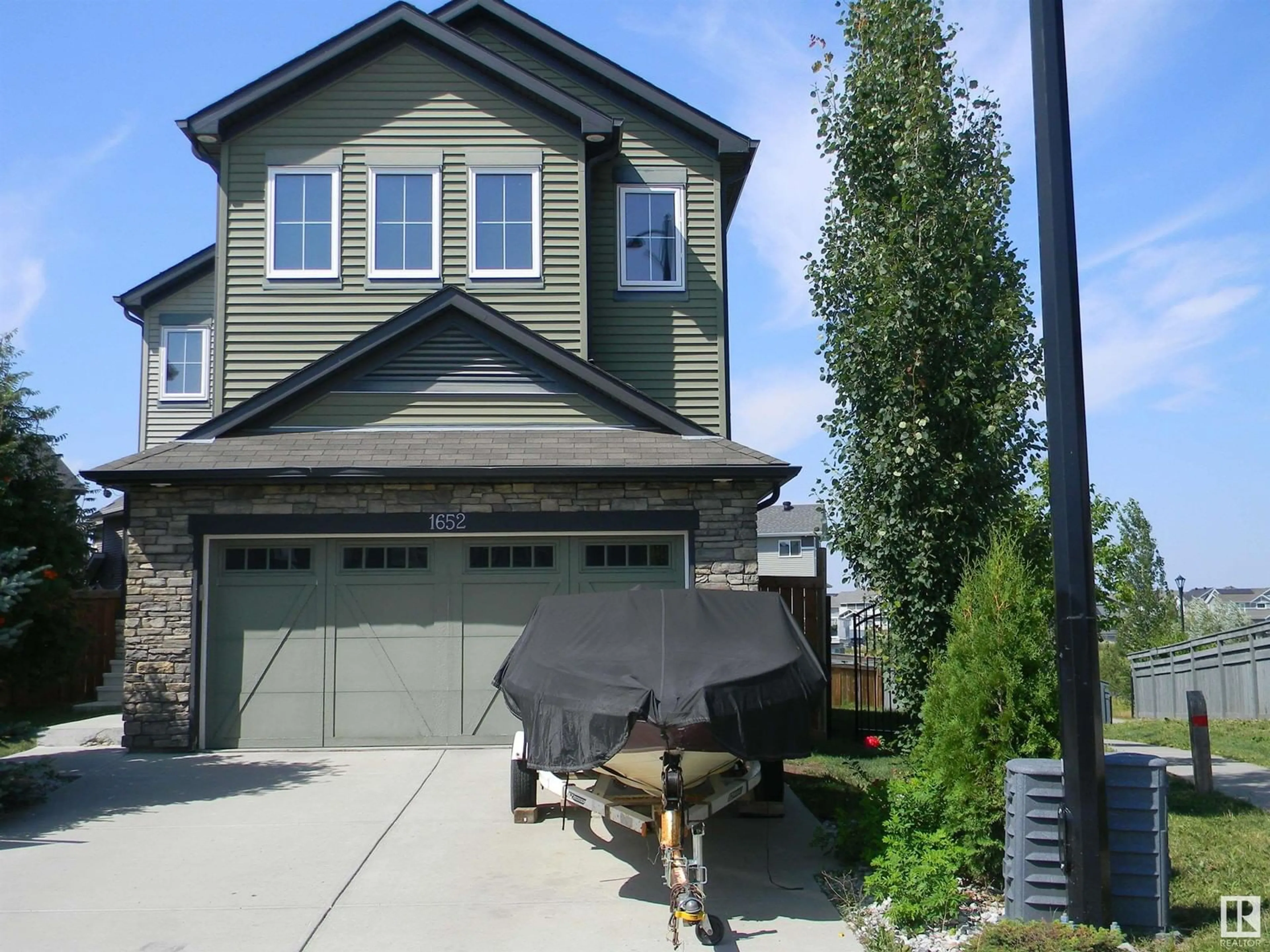 Home with vinyl exterior material, street for 1652 DAVIDSON GR SW, Edmonton Alberta T6W3J3