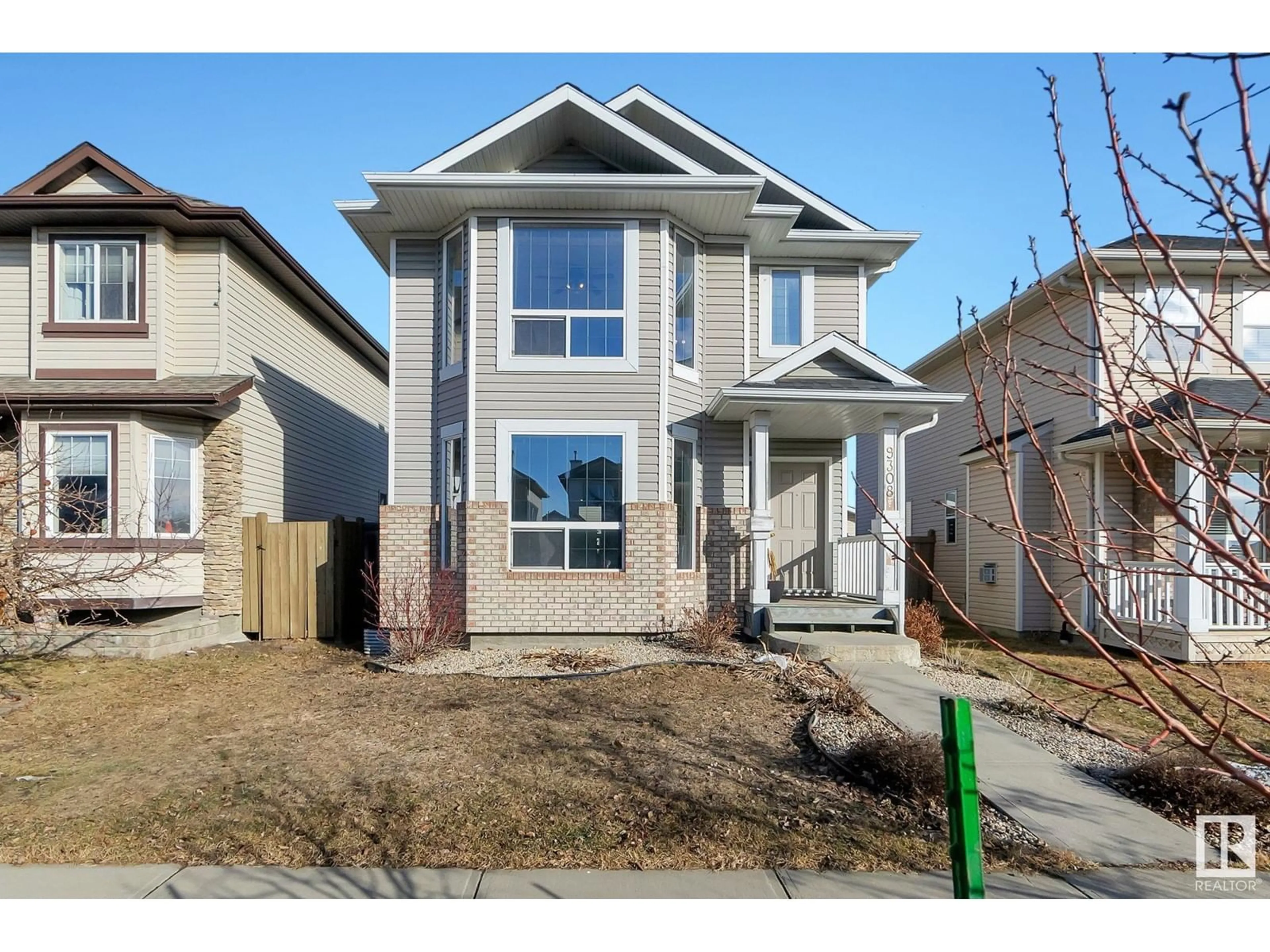 Home with vinyl exterior material, street for 9308 SIMPSON DR NW, Edmonton Alberta T6R0E4