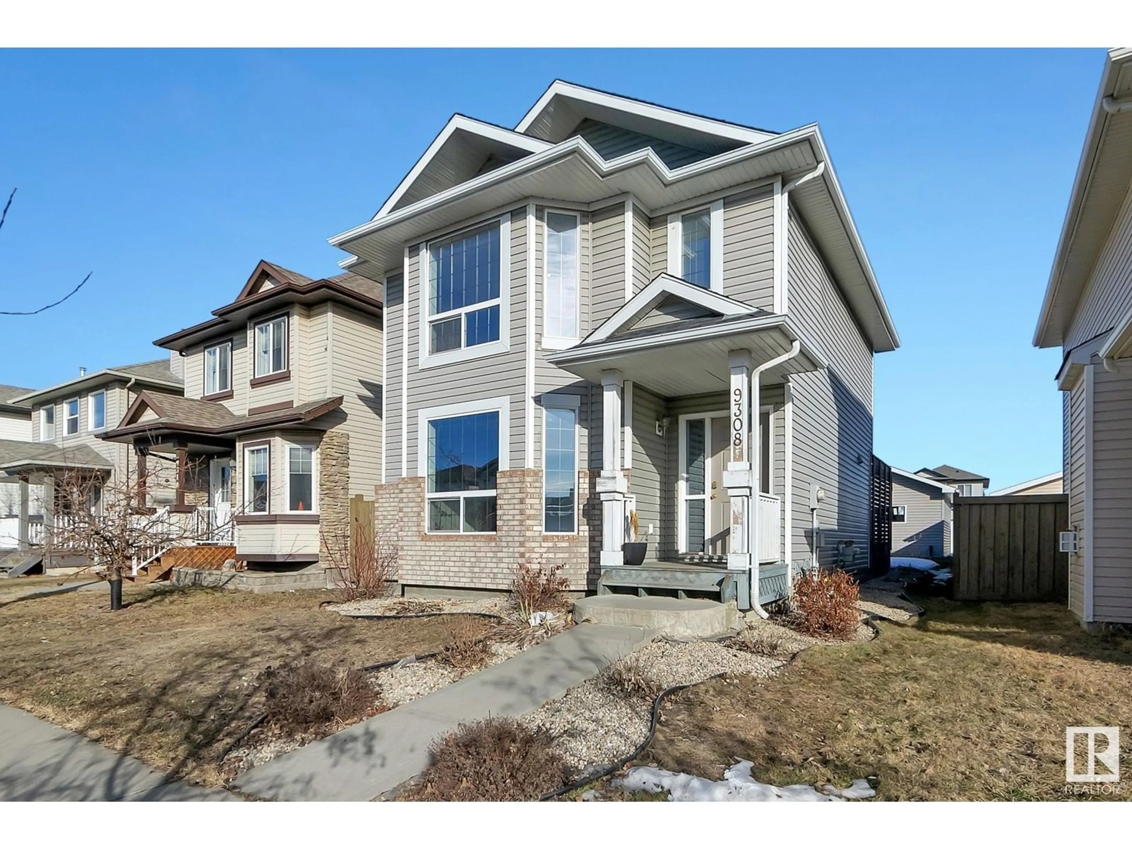 Home with vinyl exterior material, street for 9308 SIMPSON DR NW, Edmonton Alberta T6R0E4