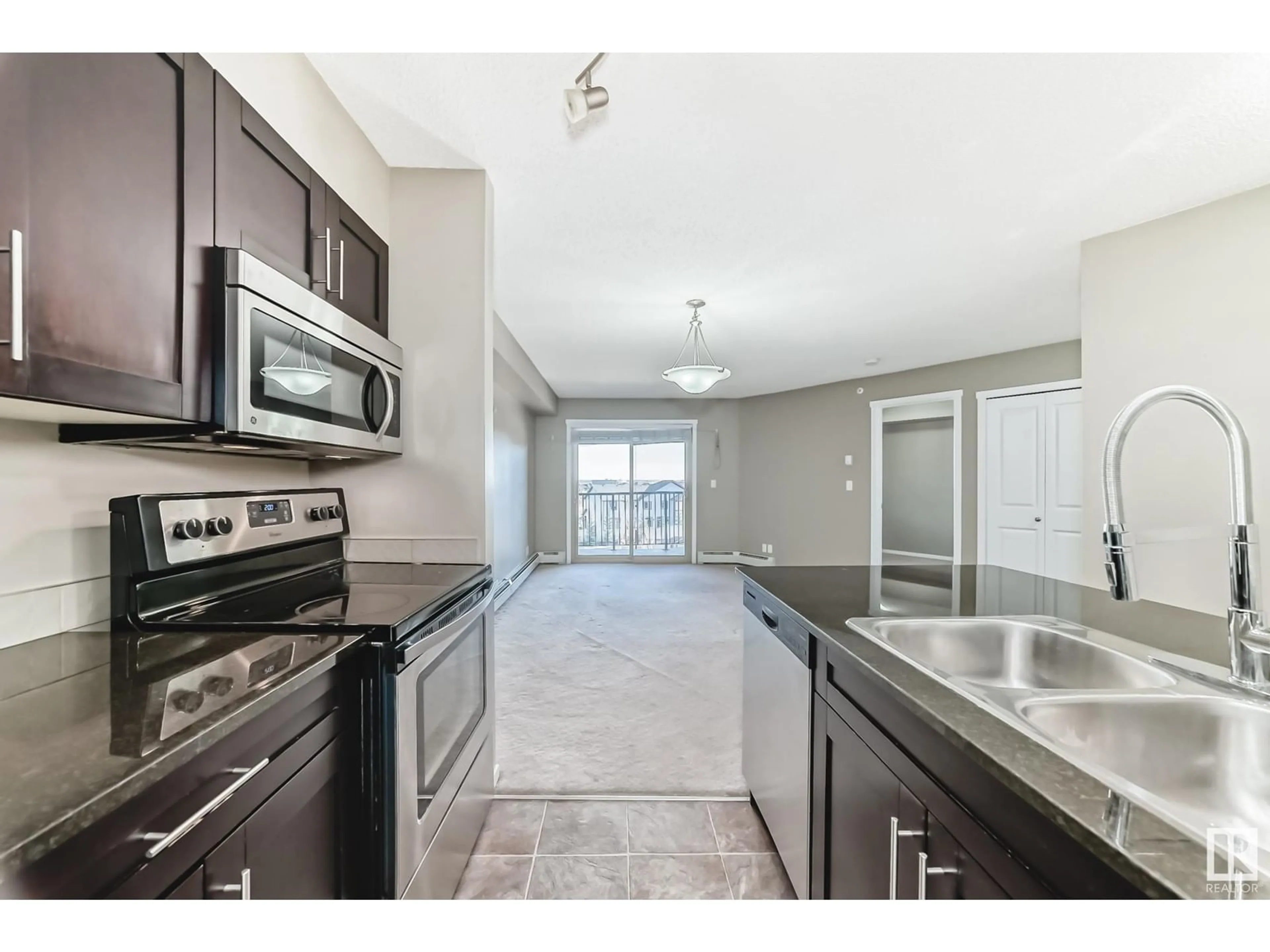 Open concept kitchen, ceramic/tile floor for #418 3315 JAMES MOWATT TR SW, Edmonton Alberta T6W3L9