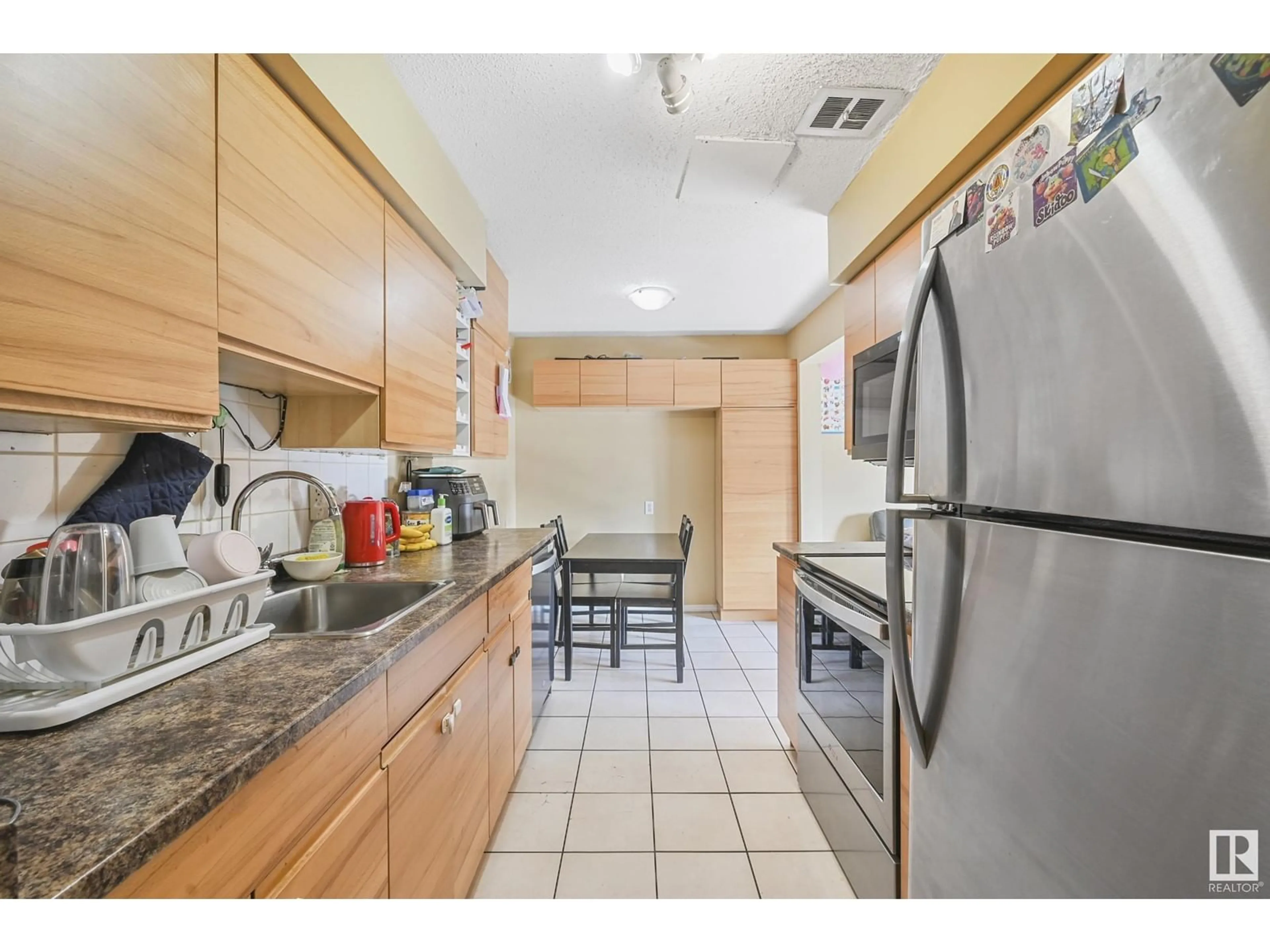 Standard kitchen, ceramic/tile floor for #2 8030 141 AV NW, Edmonton Alberta T5C2N9