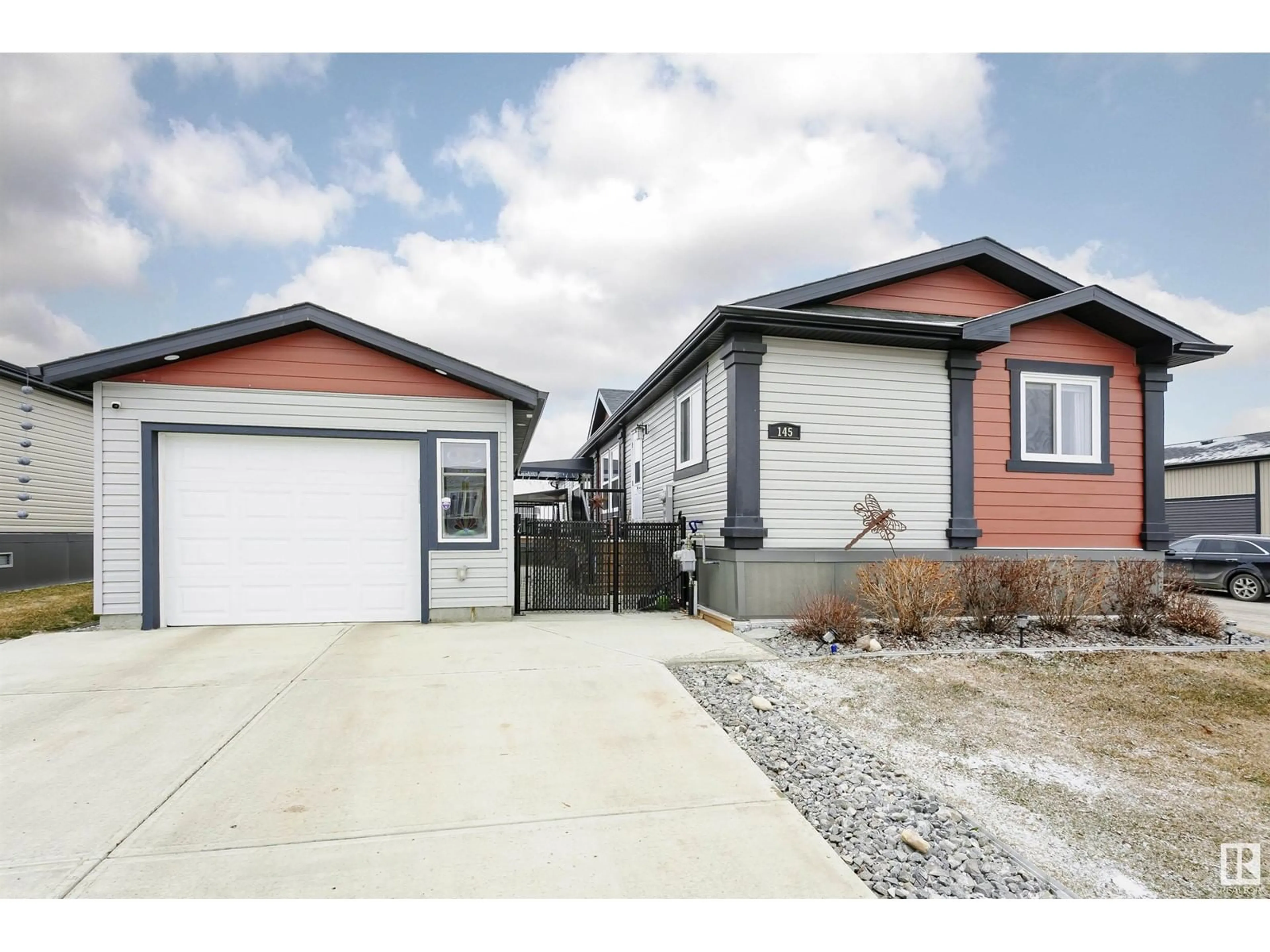 Home with vinyl exterior material, street for 145 Meadows DR, Morinville Alberta T8R2P7