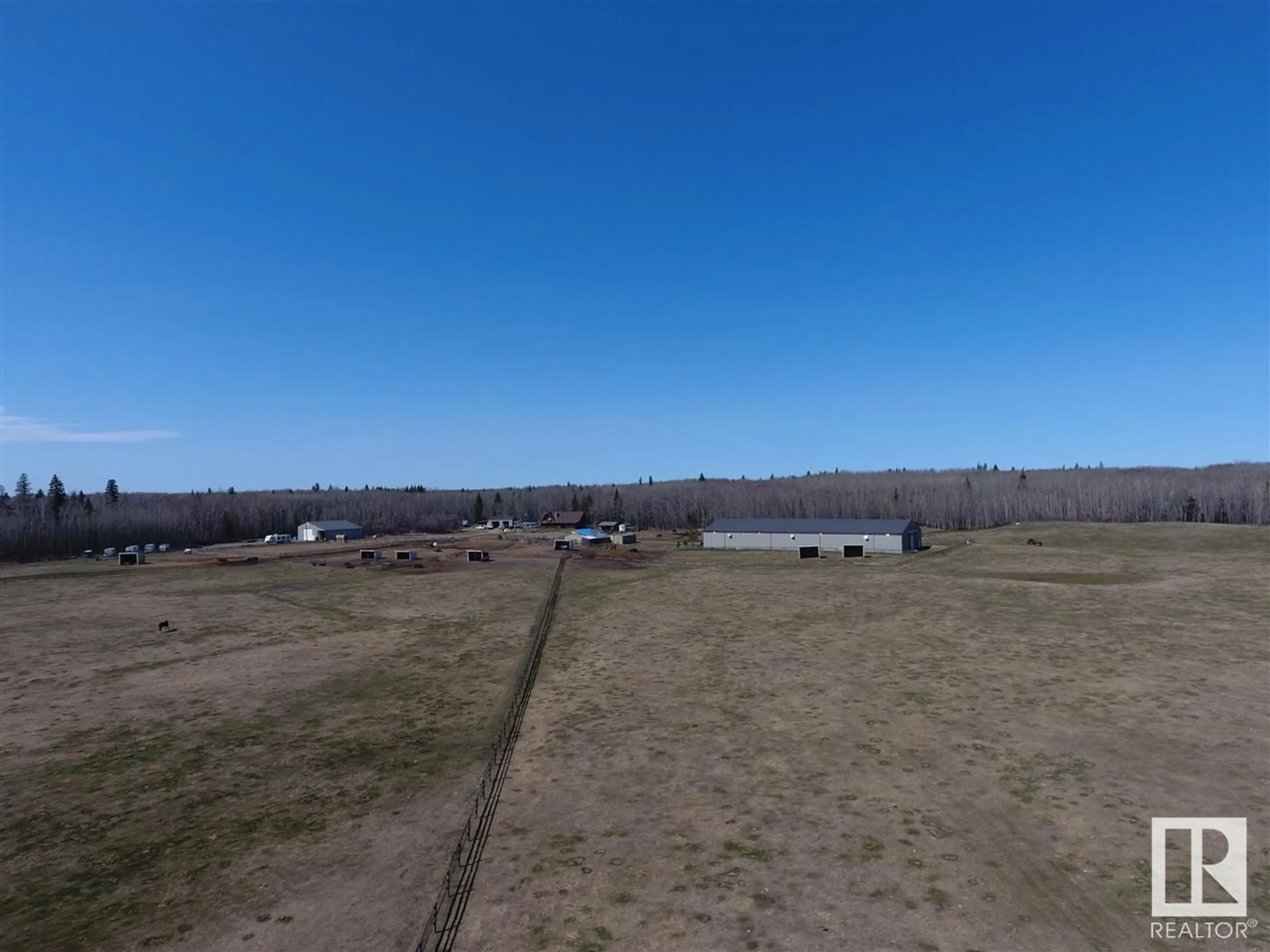 A pic from outside/outdoor area/front of a property/back of a property/a pic from drone, unknown for 21334 TWP RD 520, Rural Strathcona County Alberta T8C1G4