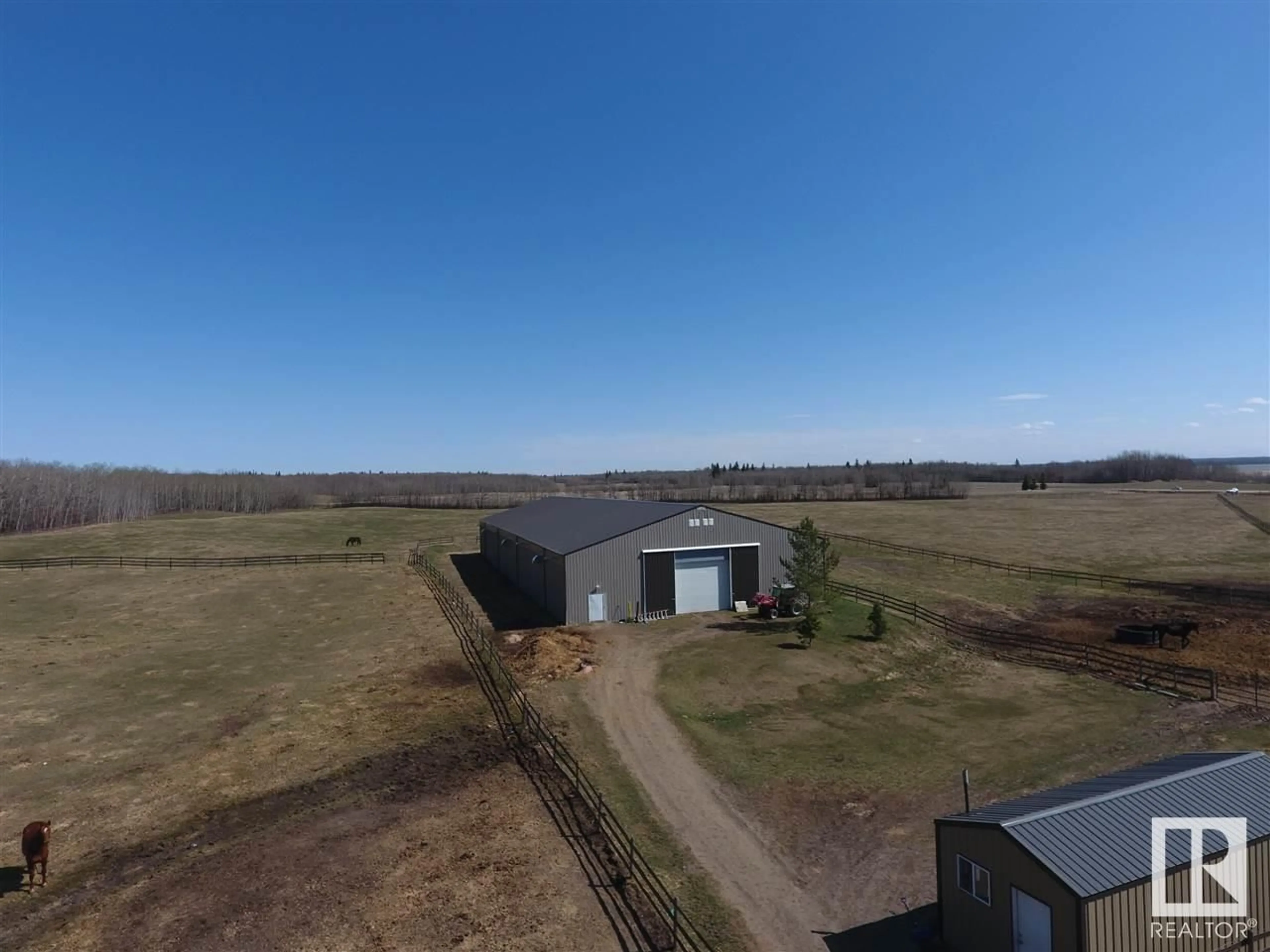 A pic from outside/outdoor area/front of a property/back of a property/a pic from drone, building for 21334 TWP RD 520, Rural Strathcona County Alberta T8C1G4