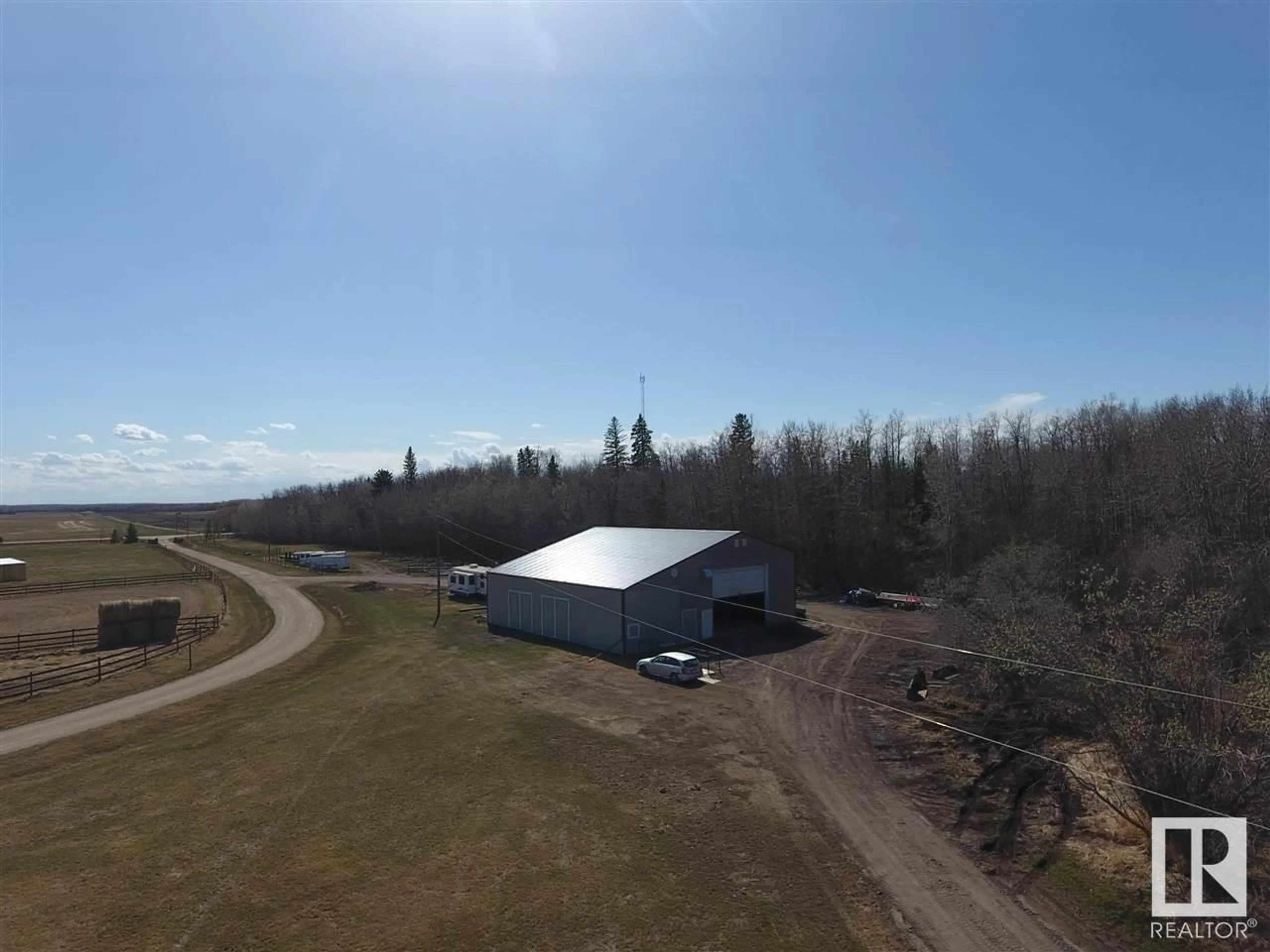 A pic from outside/outdoor area/front of a property/back of a property/a pic from drone, building for 21334 TWP RD 520, Rural Strathcona County Alberta T8C1G4