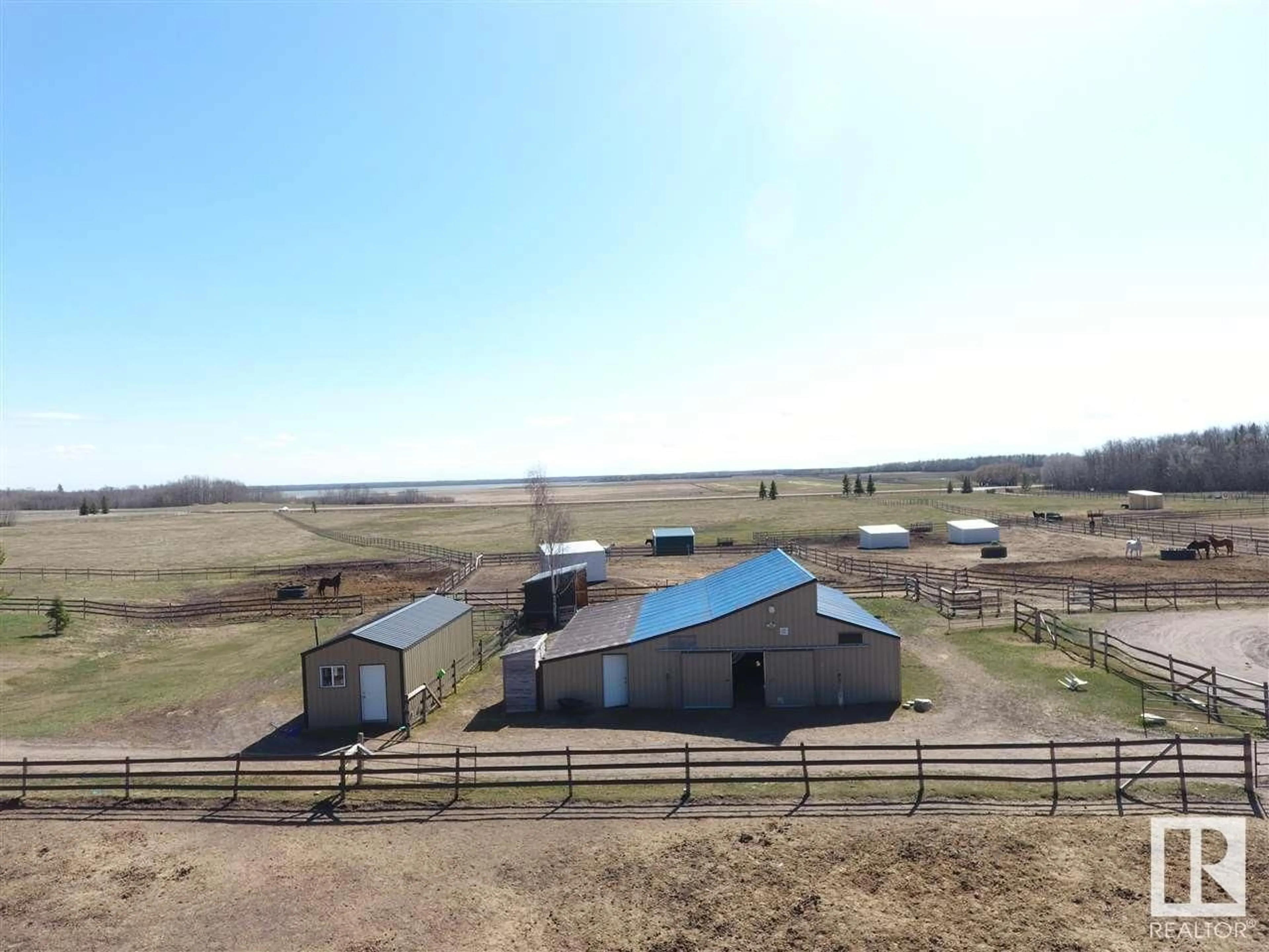 A pic from outside/outdoor area/front of a property/back of a property/a pic from drone, building for 21334 TWP RD 520, Rural Strathcona County Alberta T8C1G4