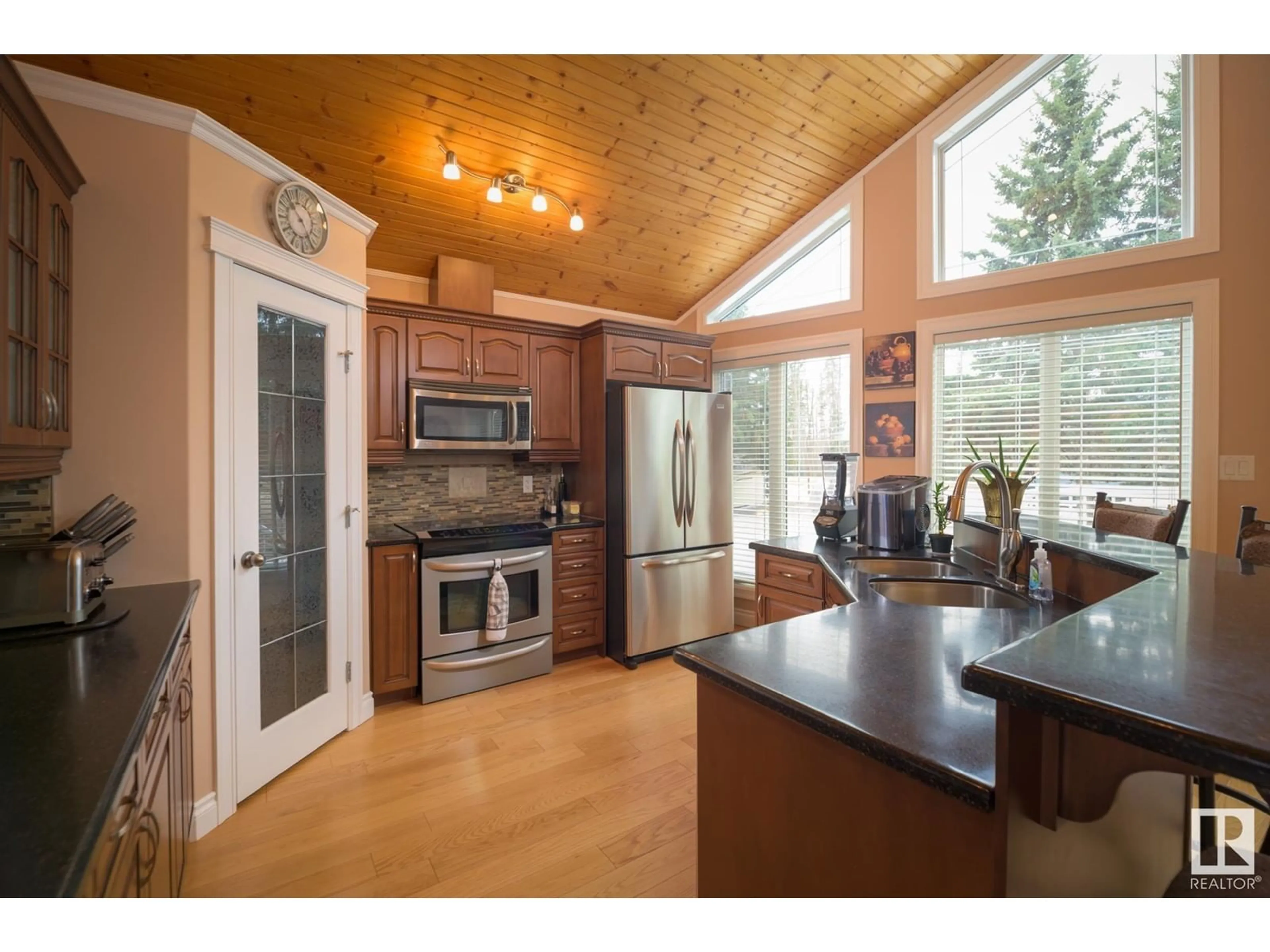 Open concept kitchen, wood/laminate floor for 15474 - 134 OLD TRAIL RD, Rural Lac La Biche County Alberta T0A2T0