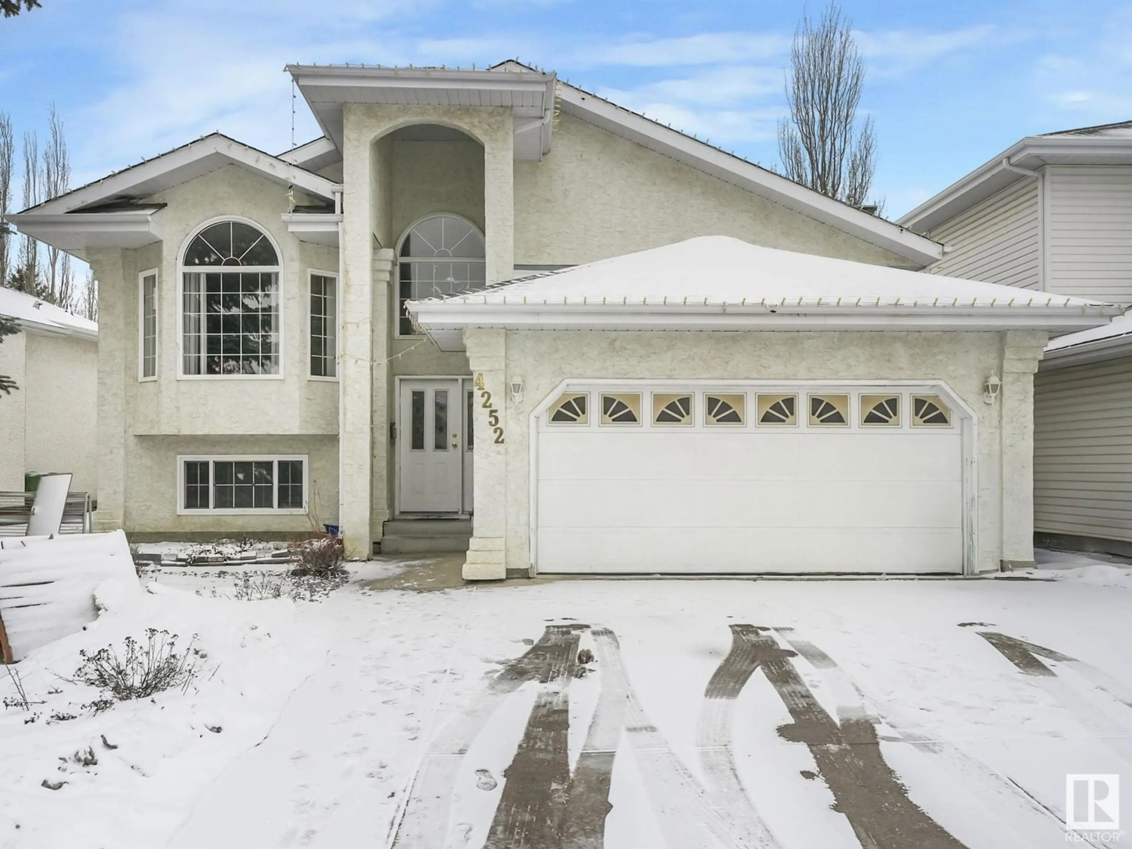 Home with vinyl exterior material, street for 4252 46 ST NW NW, Edmonton Alberta T6L6L9