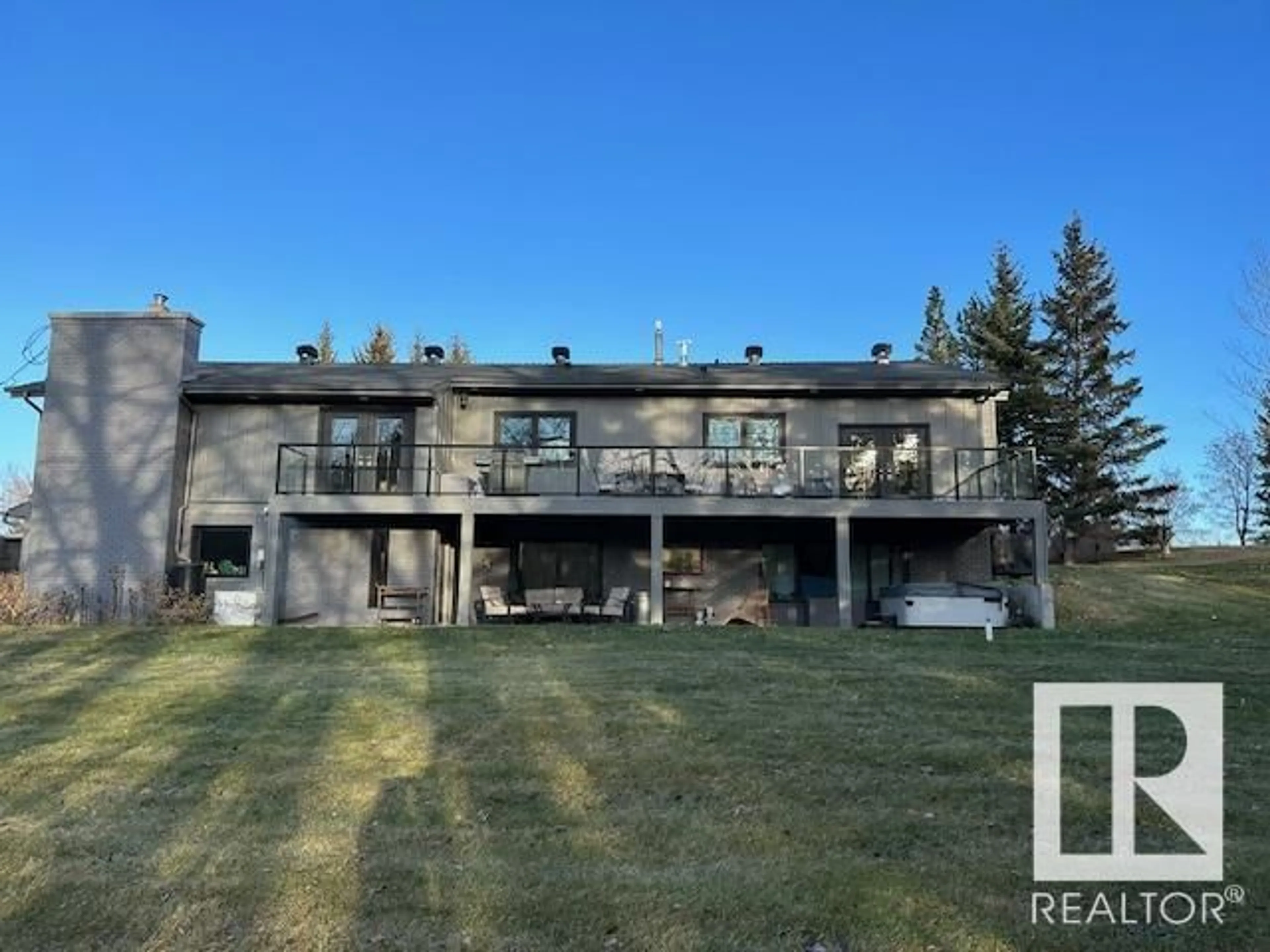 A pic from outside/outdoor area/front of a property/back of a property/a pic from drone, unknown for #385 22560 WYE RD, Rural Strathcona County Alberta T8A4T6