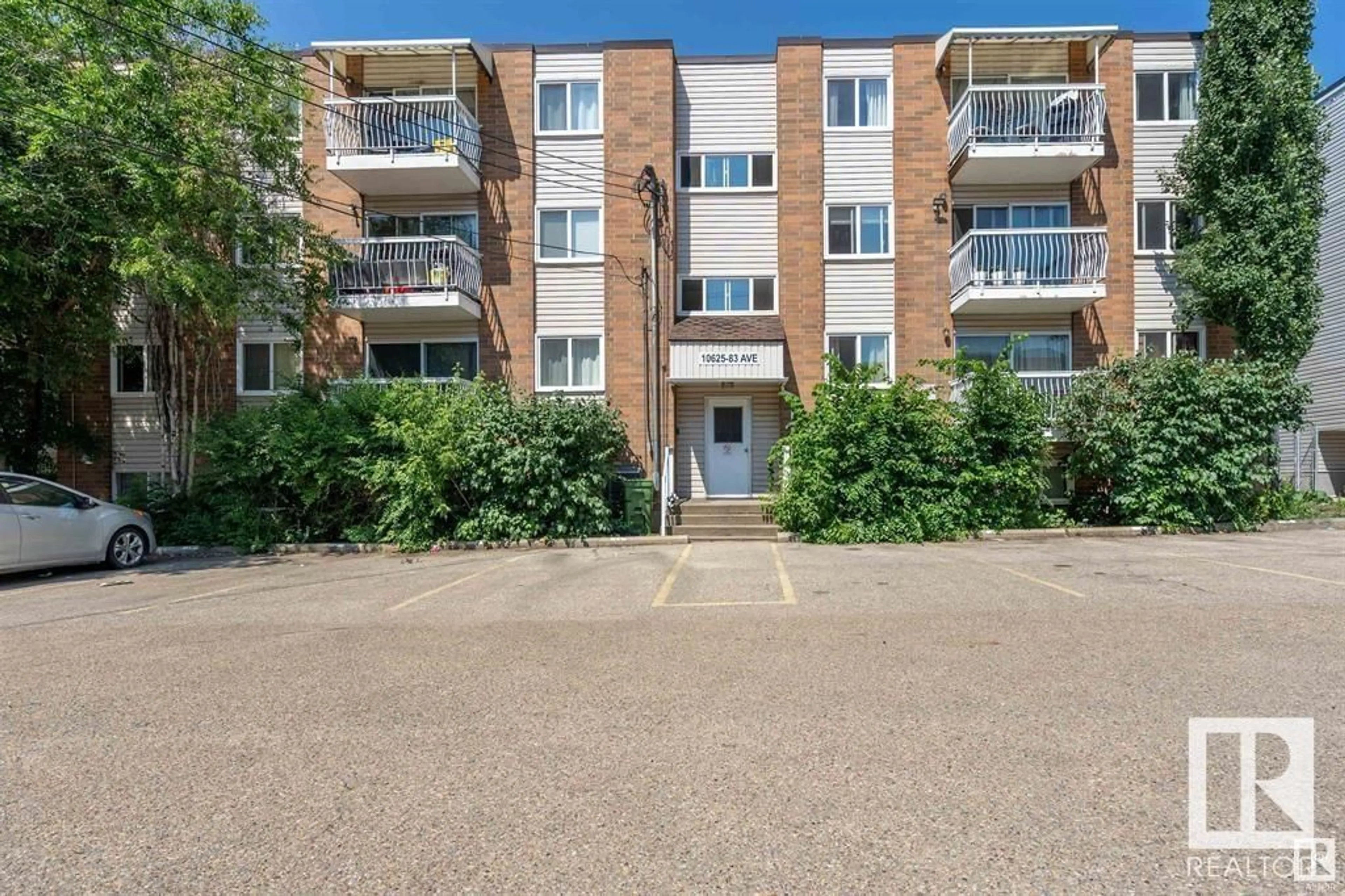 A pic from outside/outdoor area/front of a property/back of a property/a pic from drone, street for #404 10625 83 AV NW, Edmonton Alberta T6E2E3