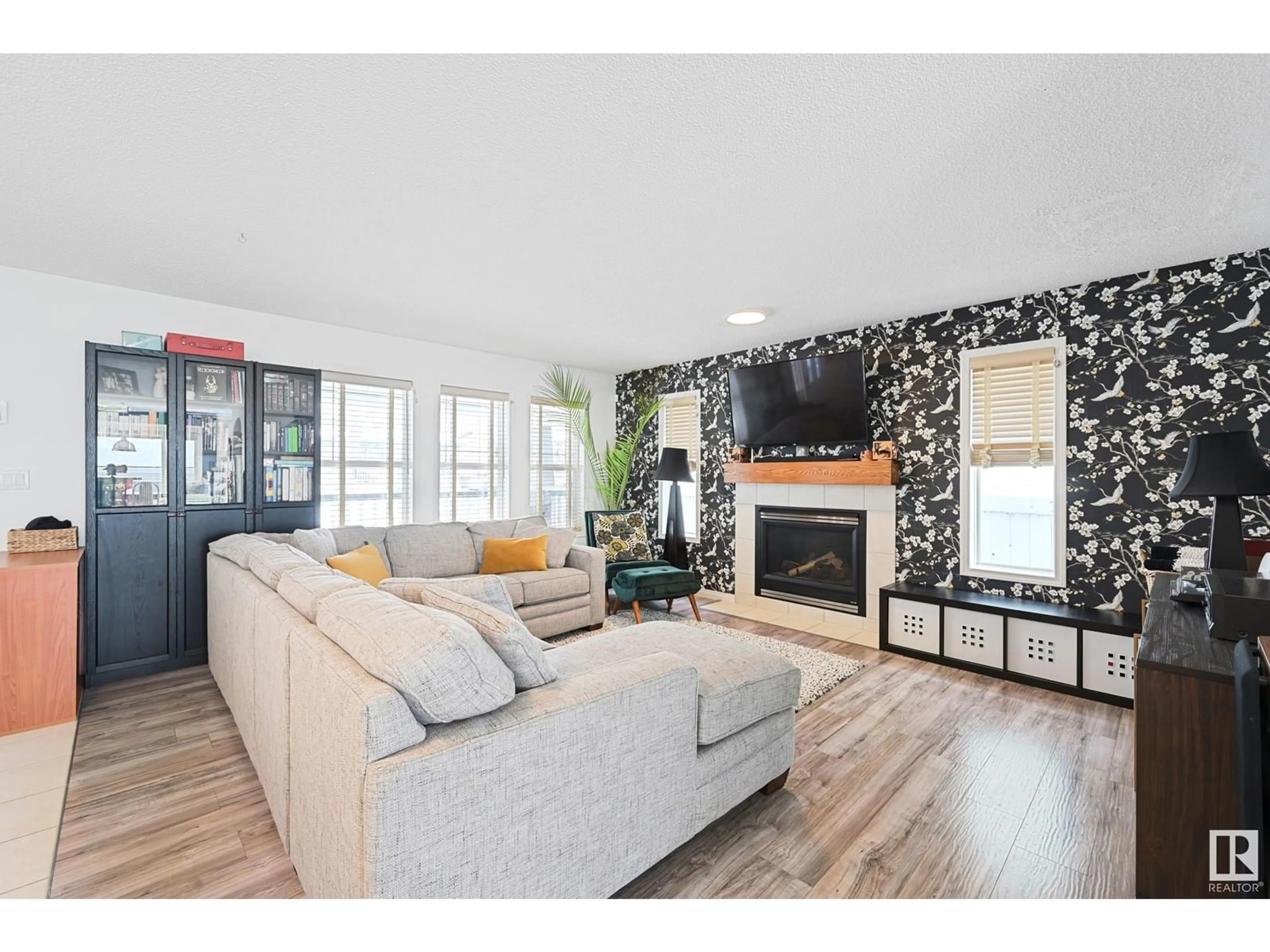 Living room with furniture, wood/laminate floor for 1829 TUFFORD WY NW, Edmonton Alberta T6R2W3