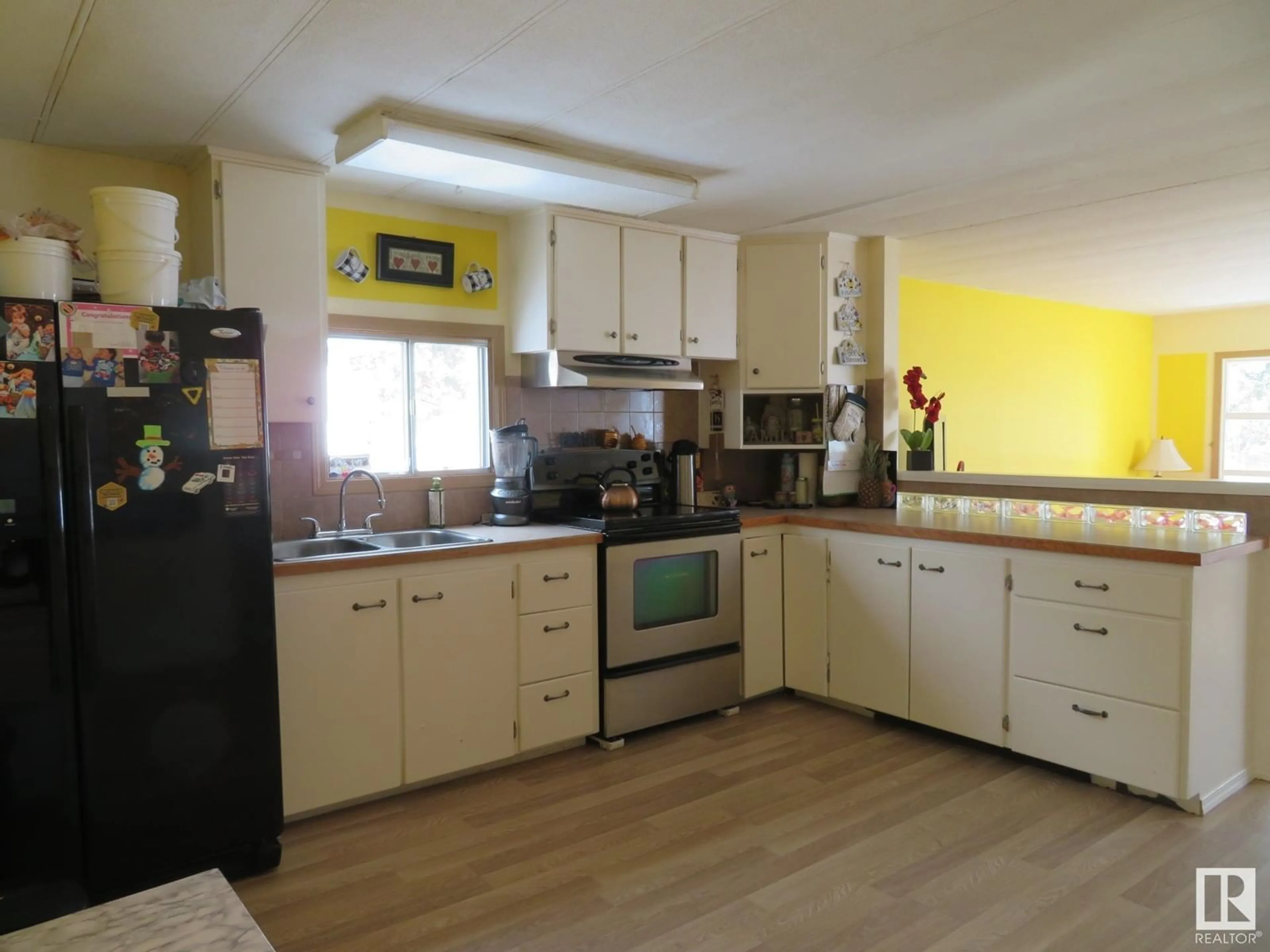 Open concept kitchen, wood/laminate floor for 5112 51 ST, Entwistle Alberta T0S0S0